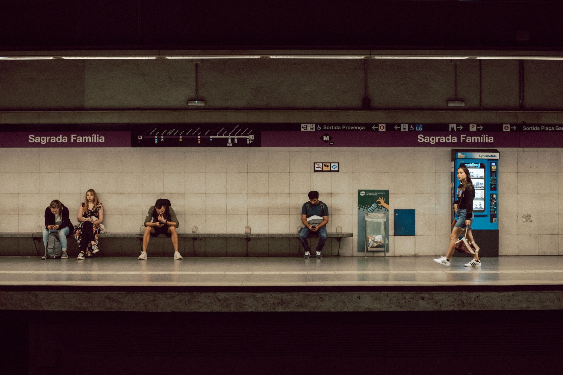 Commuters at Sagrada Familia station in Barcelona on a typical day.