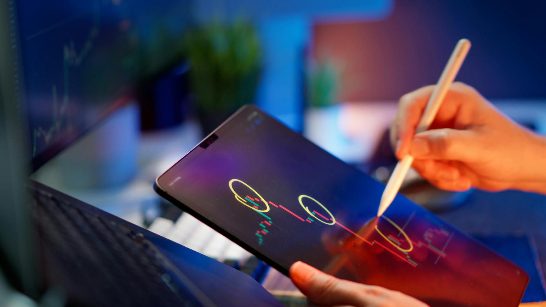 Person analyzing cryptocurrency trends on a tablet with digital pen.