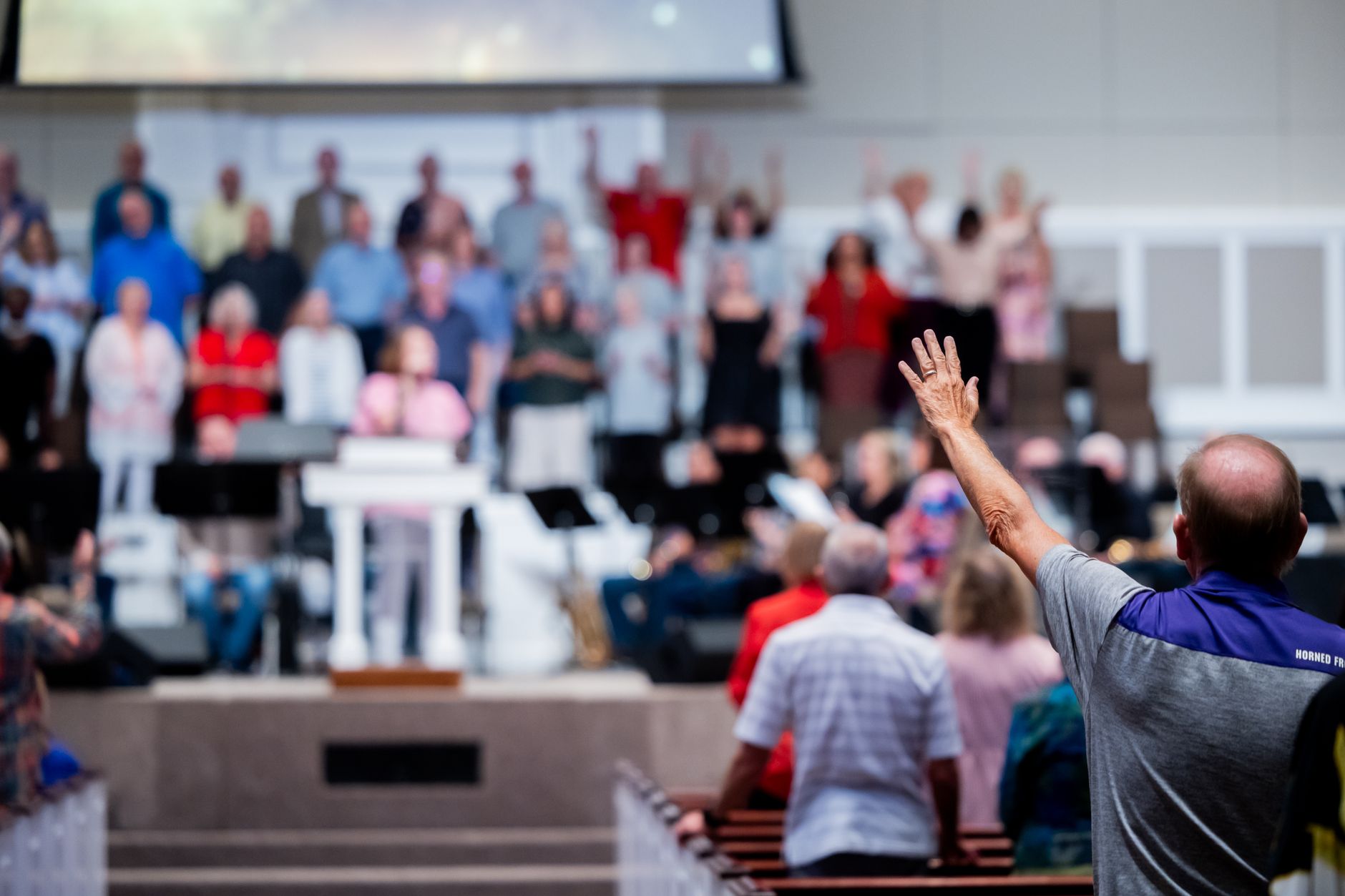 A church congregation participates in a worship service with a focus on community and spirituality.