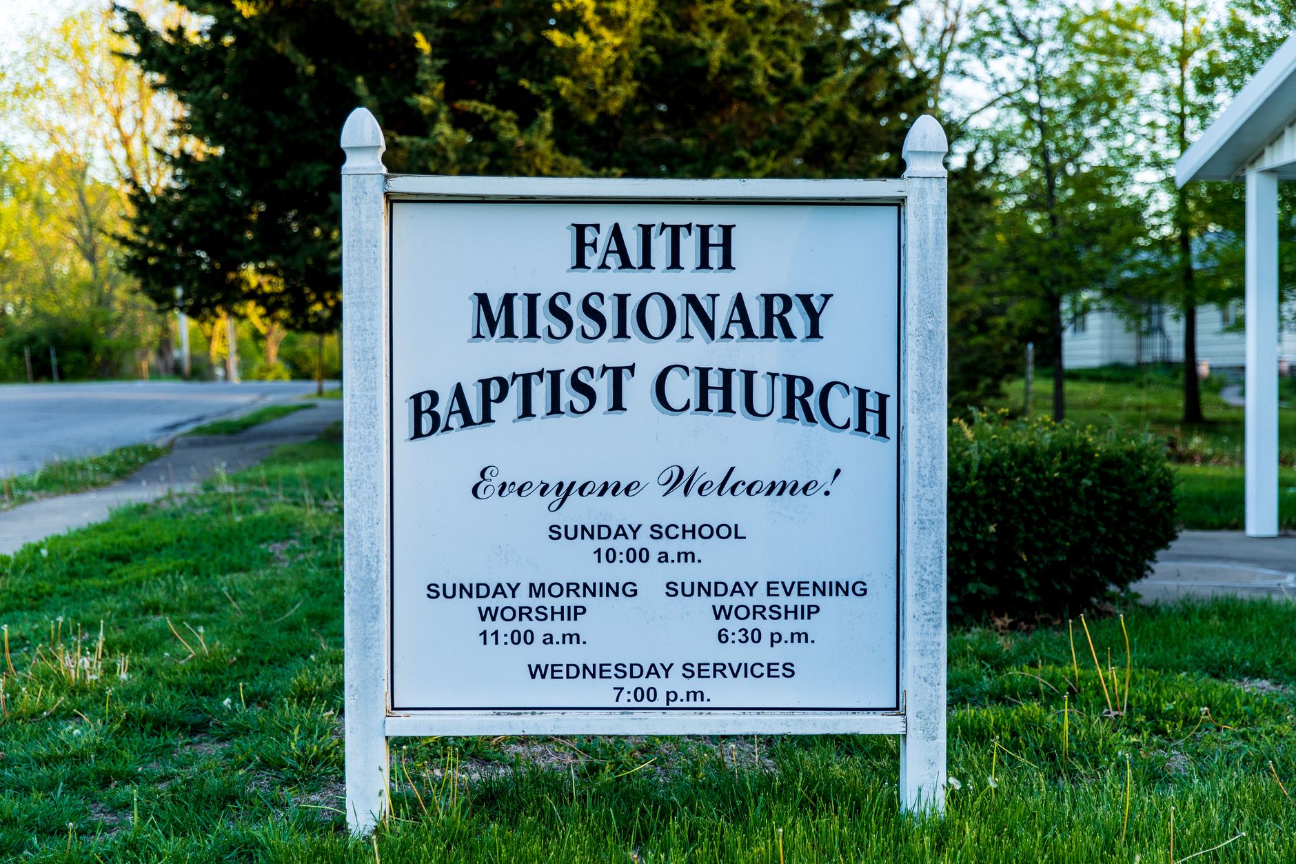 Sign for Faith Missionary Baptist Church with service times in Kansas City, MO.