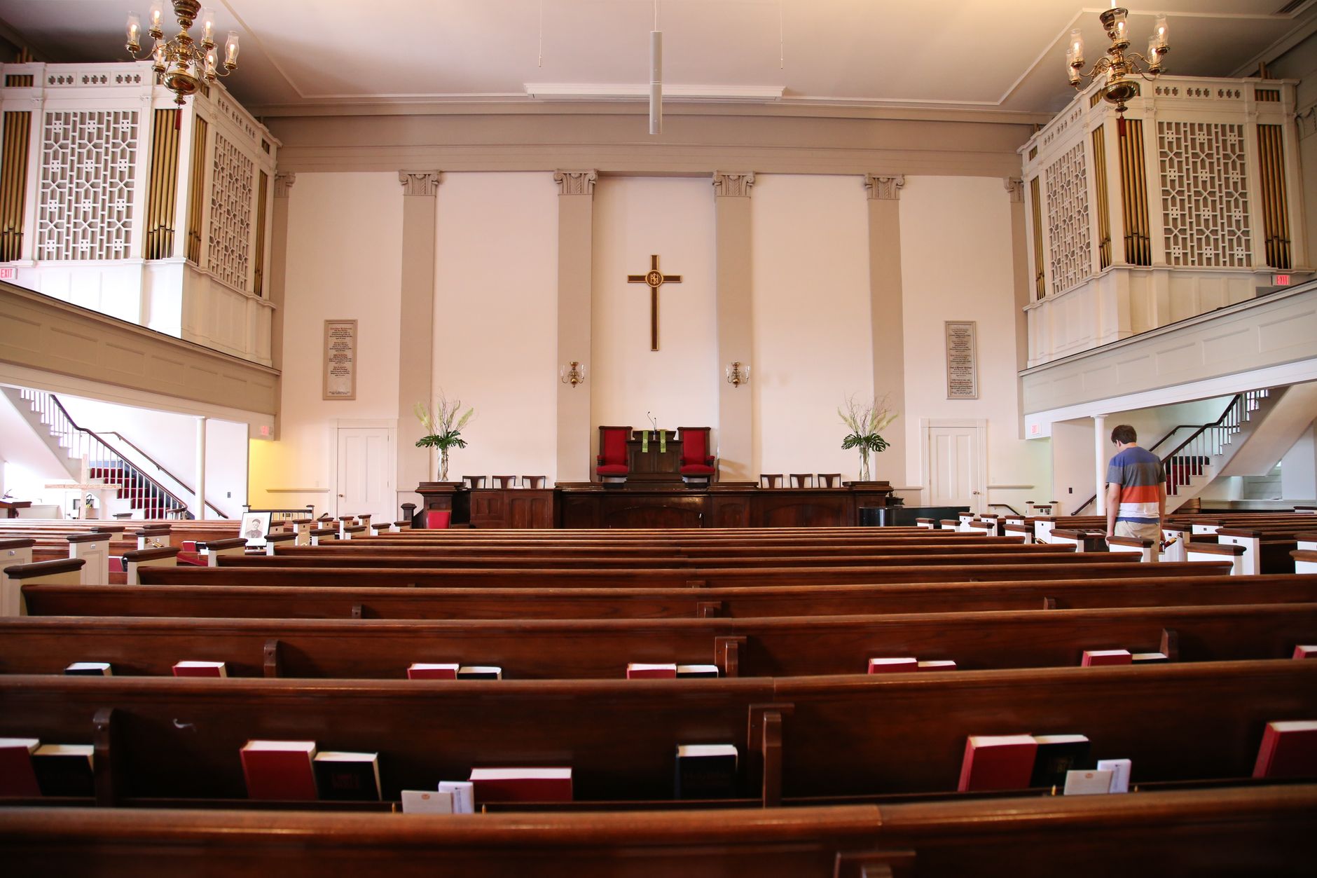 Beautiful interior of a historic church in Boston with wooden benches and altar.