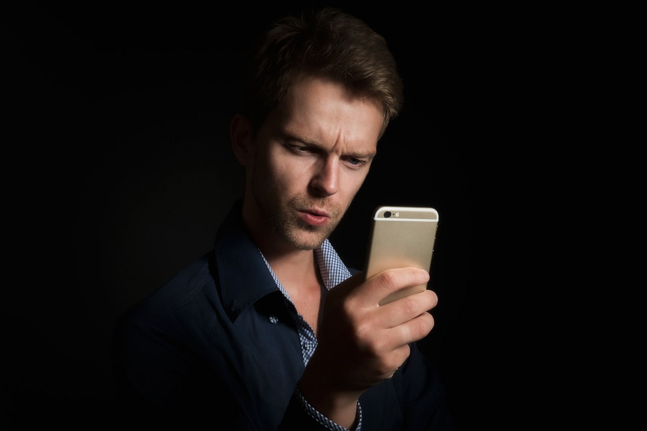 Pastor using pastoral counseling scheduling app on tablet in office