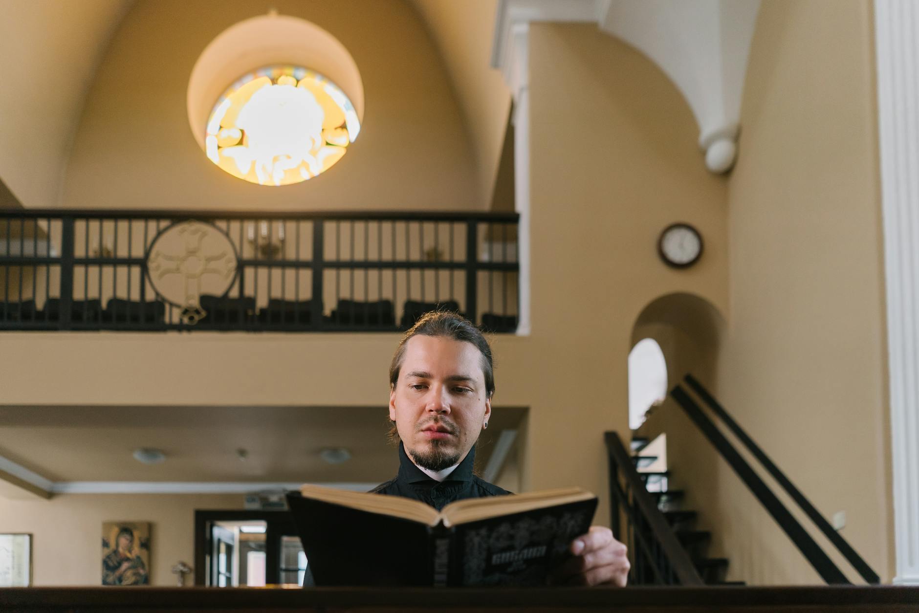 Milwaukee pastor reviewing online schedule in church office