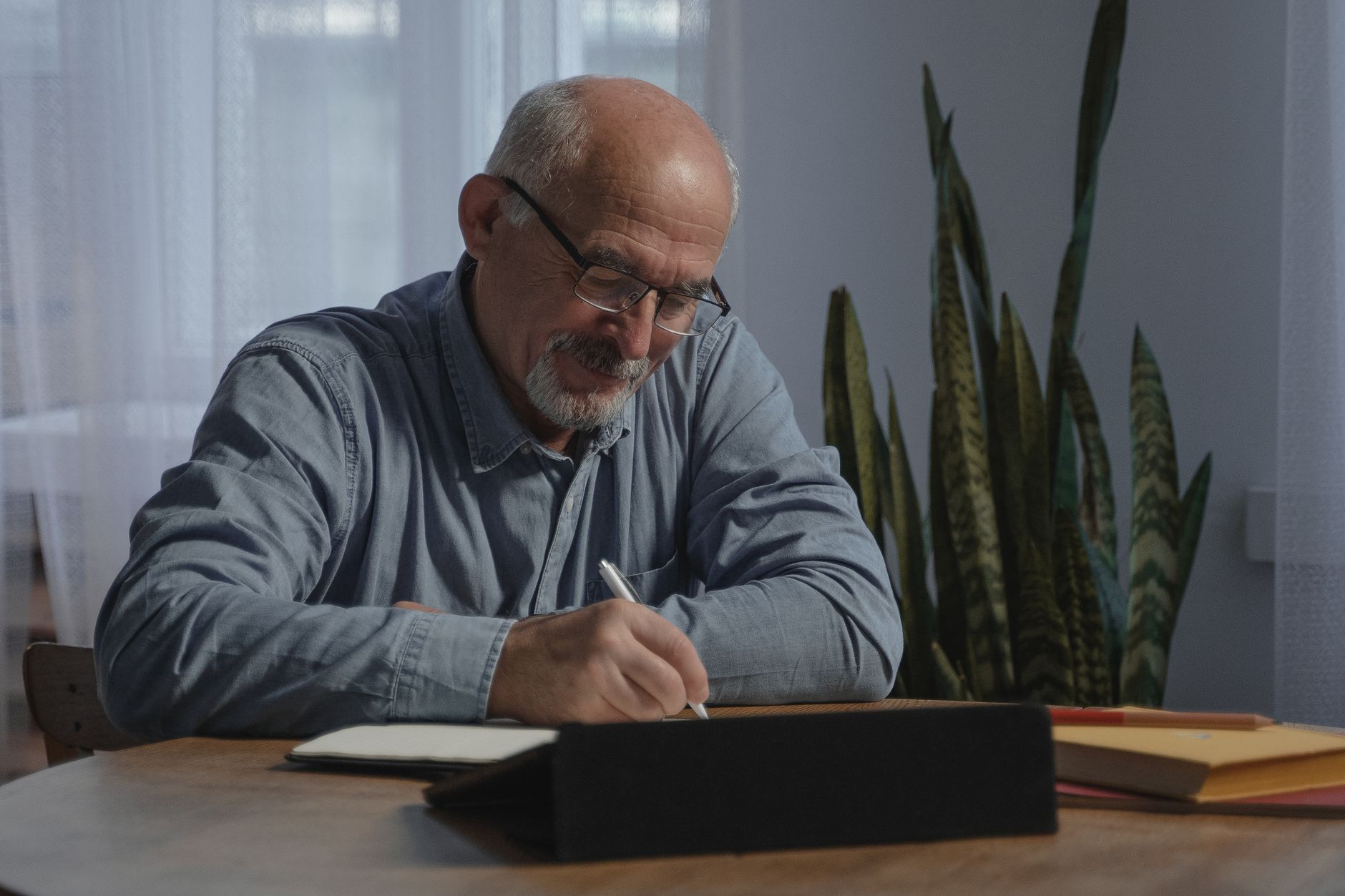 Pastor reviewing a digital scheduling calendar in an Oklahoma City church office