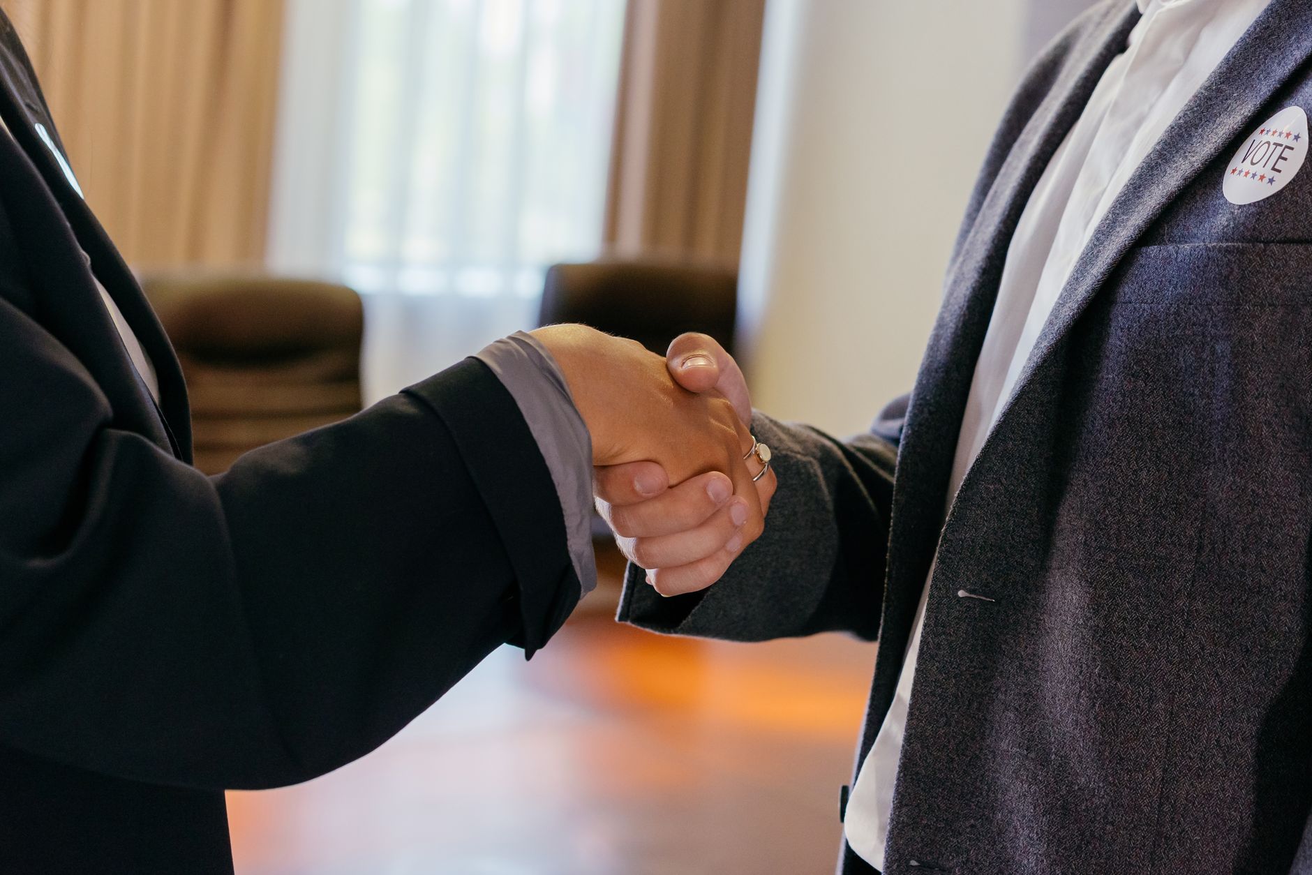 Pastor shaking hands with a church member after a scheduled appointment in Charlotte