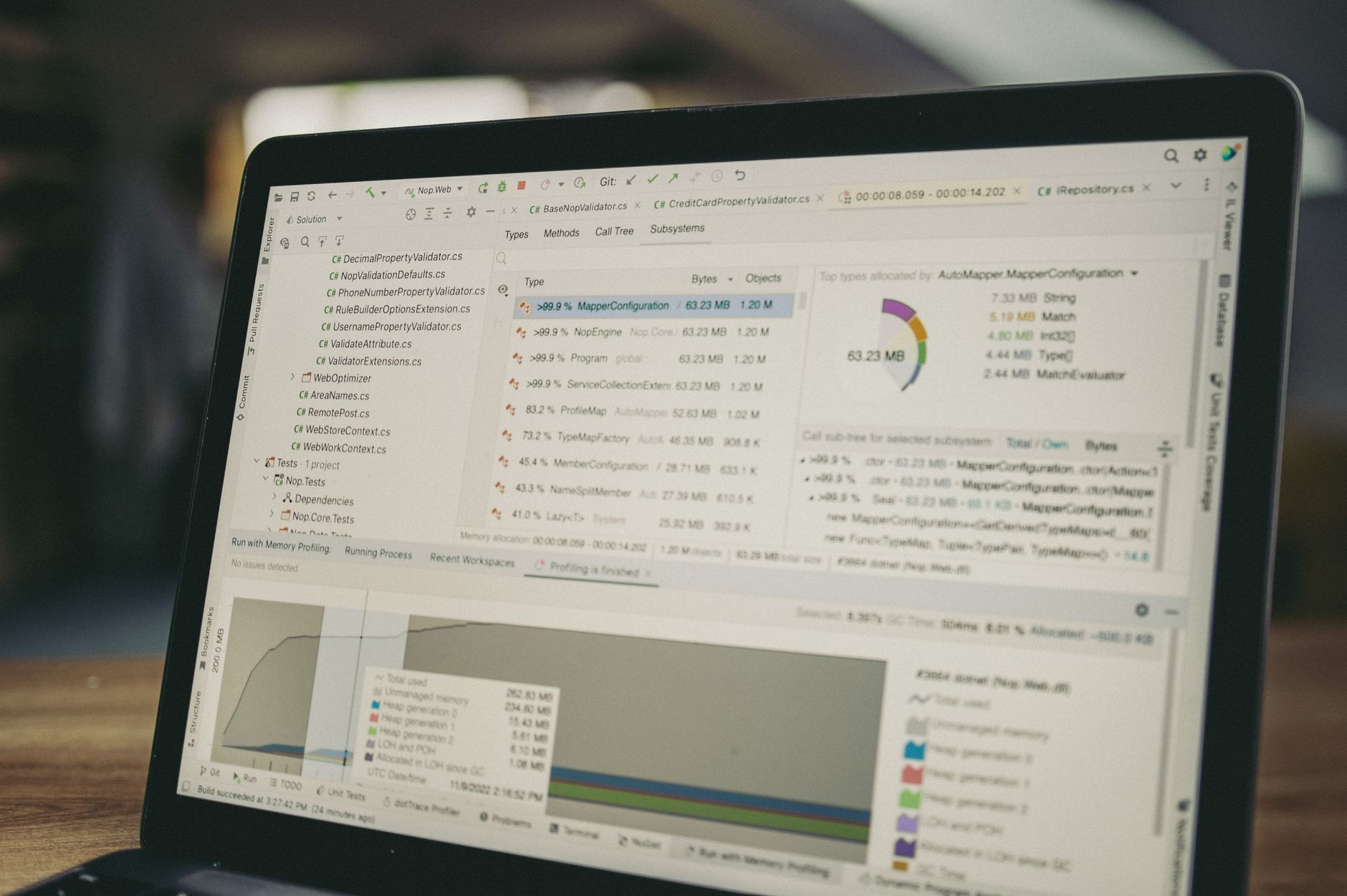 Church staff training on a scheduling software with a laptop and paper calendar