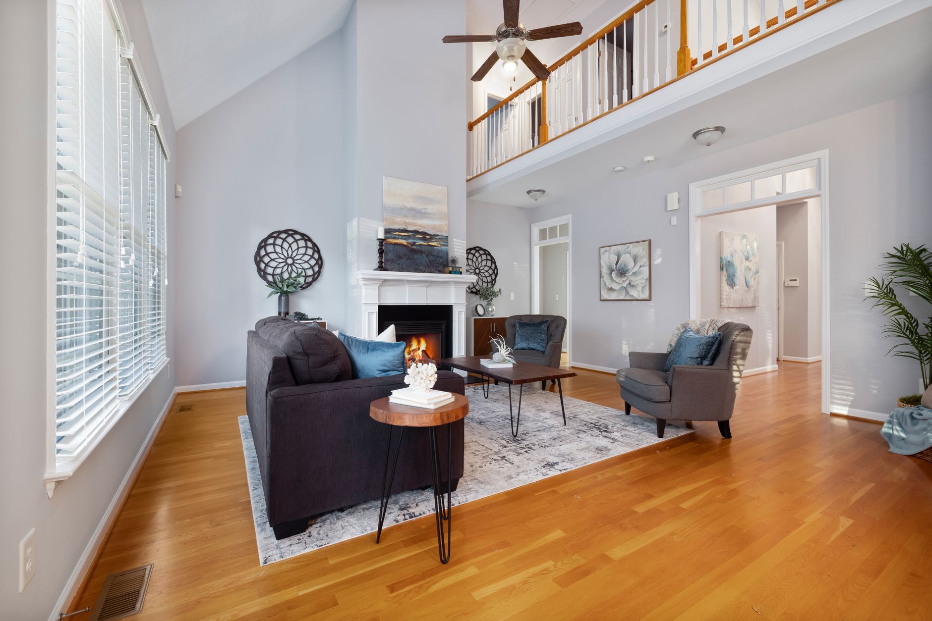 A stylish, cozy living room featuring a fireplace and elegant modern décor.