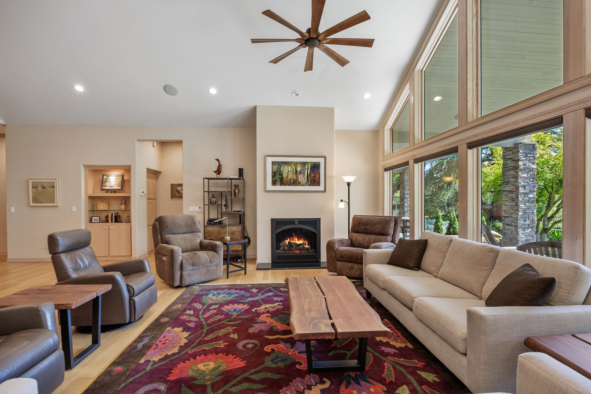 Inviting living room with fireplace, modern furniture, and scenic views in California.