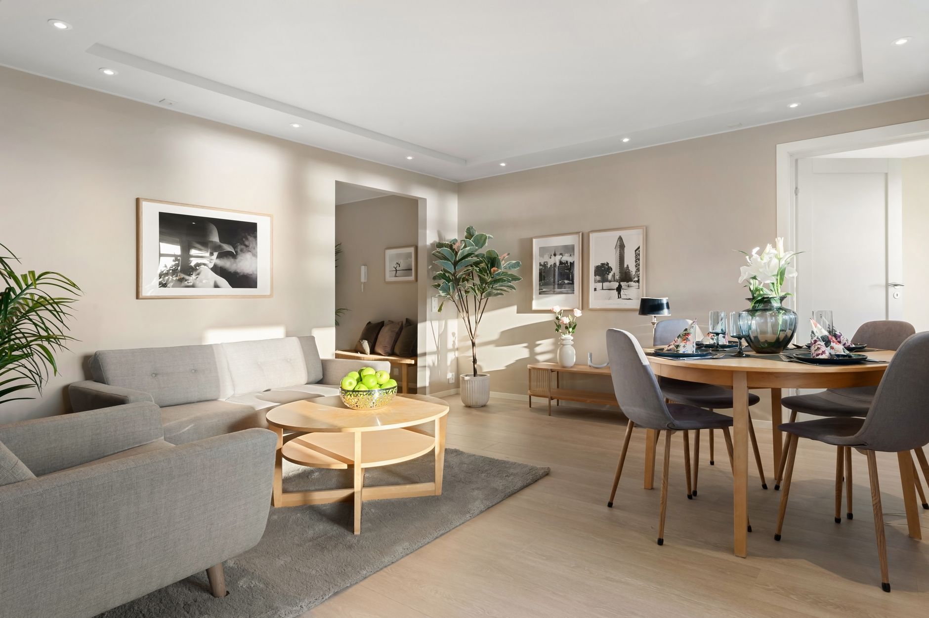 Bright modern living room with wooden furniture and elegant decor.