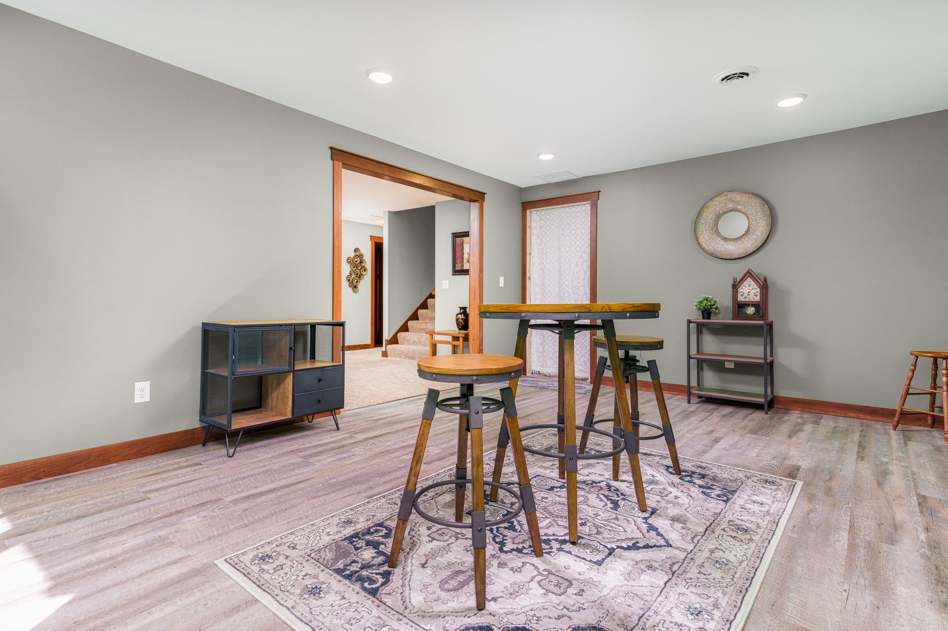 Spacious modern living room with elegant furniture and wall decor.