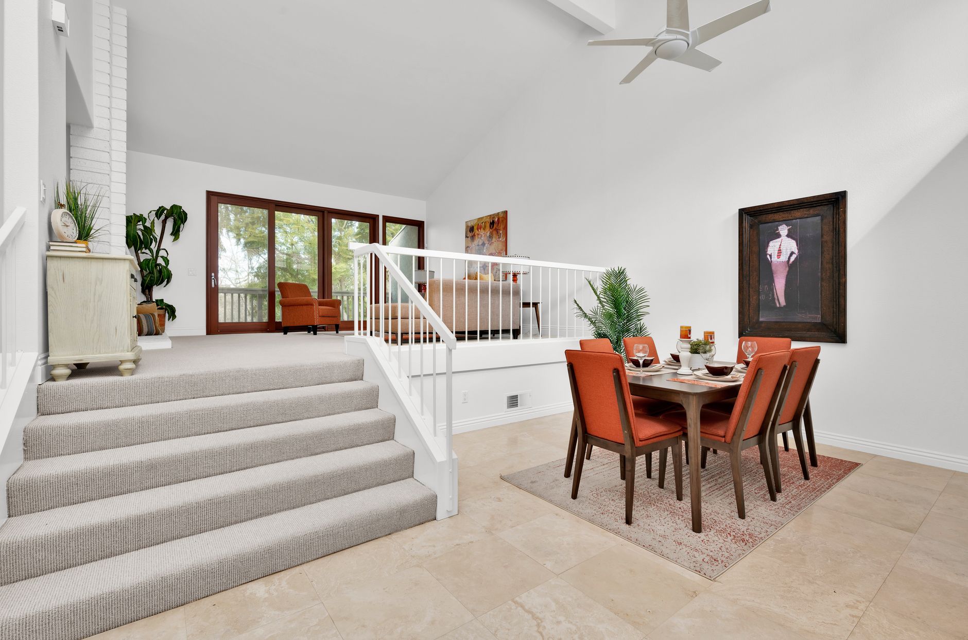 Bright and modern dining area with orange accents in an Irvine, CA home interior.