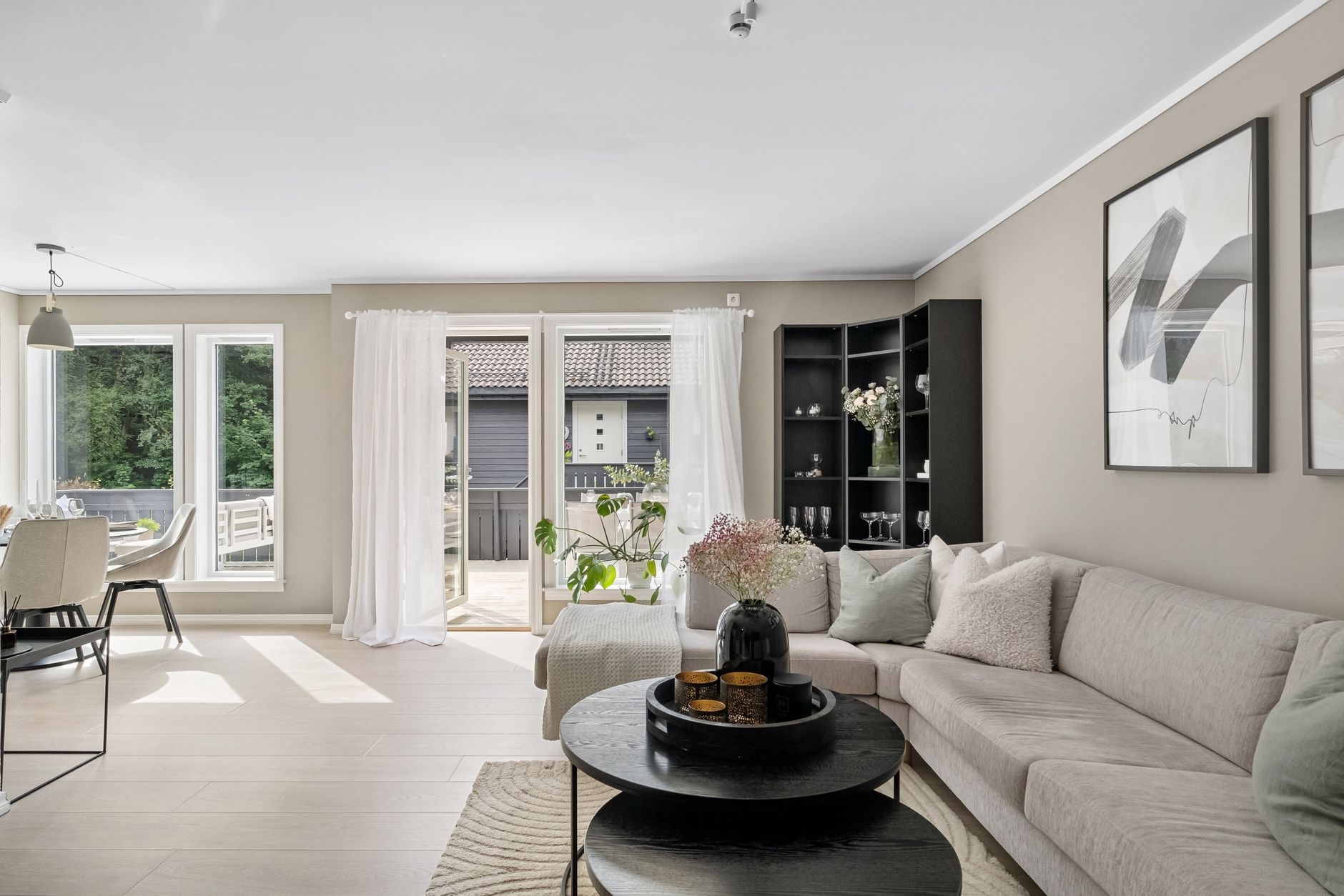 Stylish living room with contemporary furniture and ample natural light.