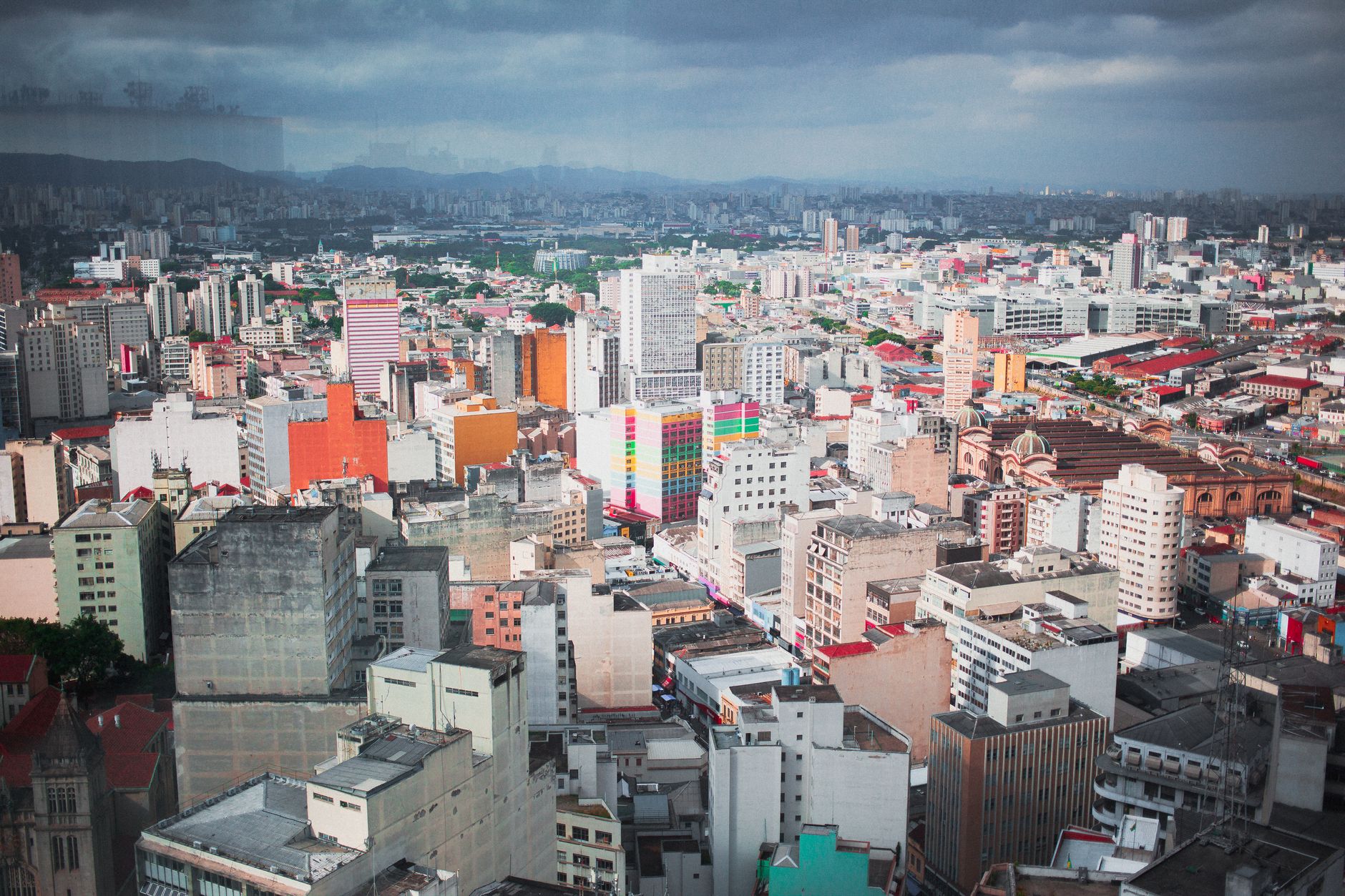 A dynamic aerial view of a colorful urban cityscape showcasing diverse architecture.
