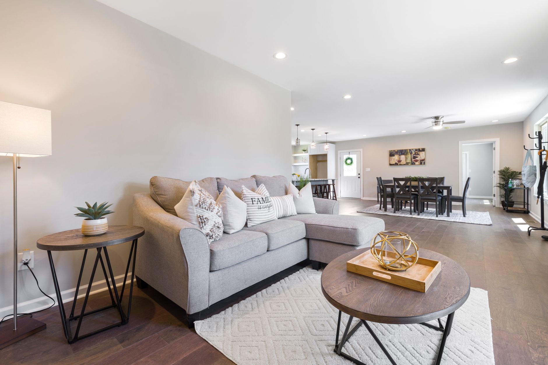 Spacious modern living room featuring stylish furniture and neutral decor.