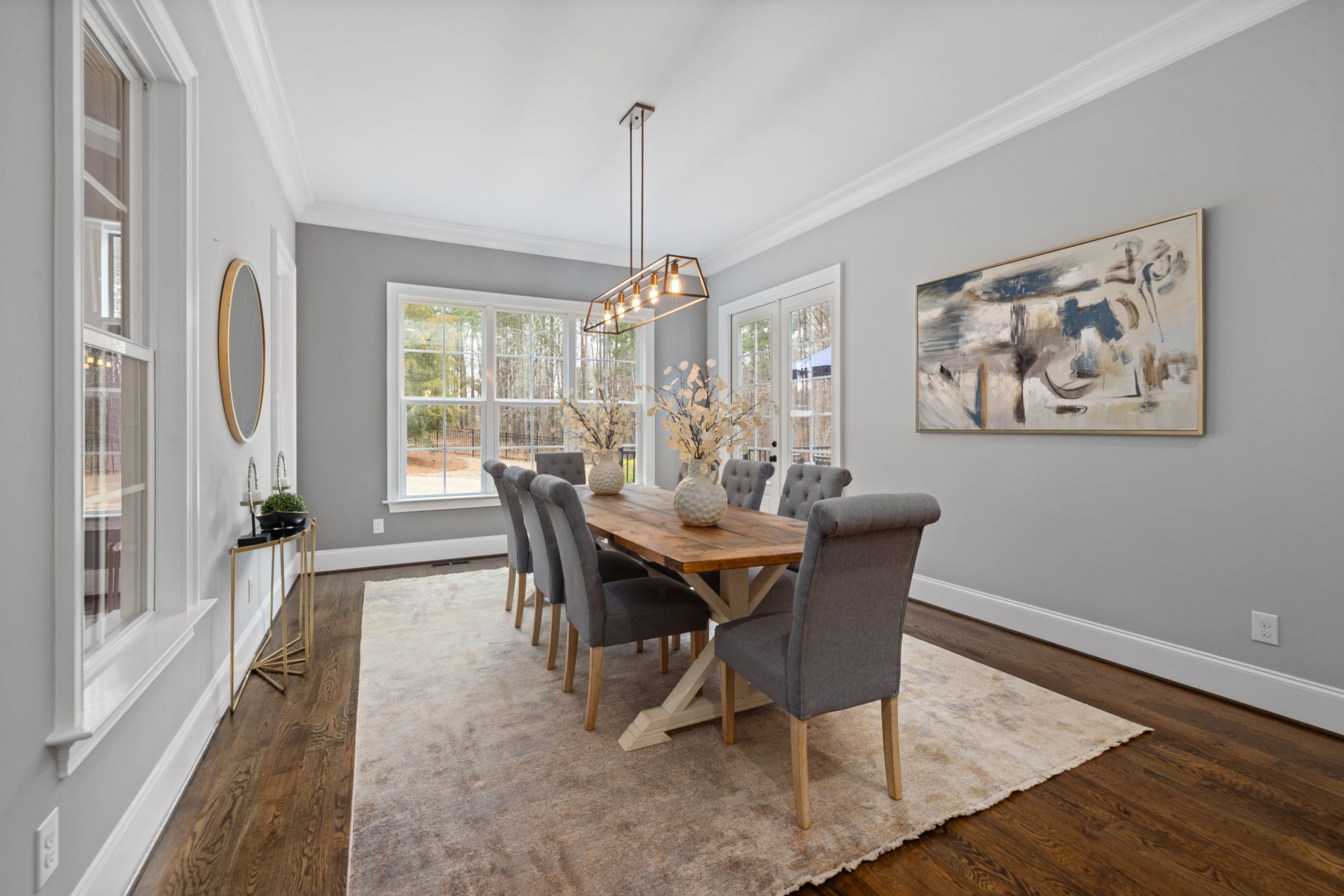Spacious dining room with modern decor and natural lighting, perfect for stylish gatherings.