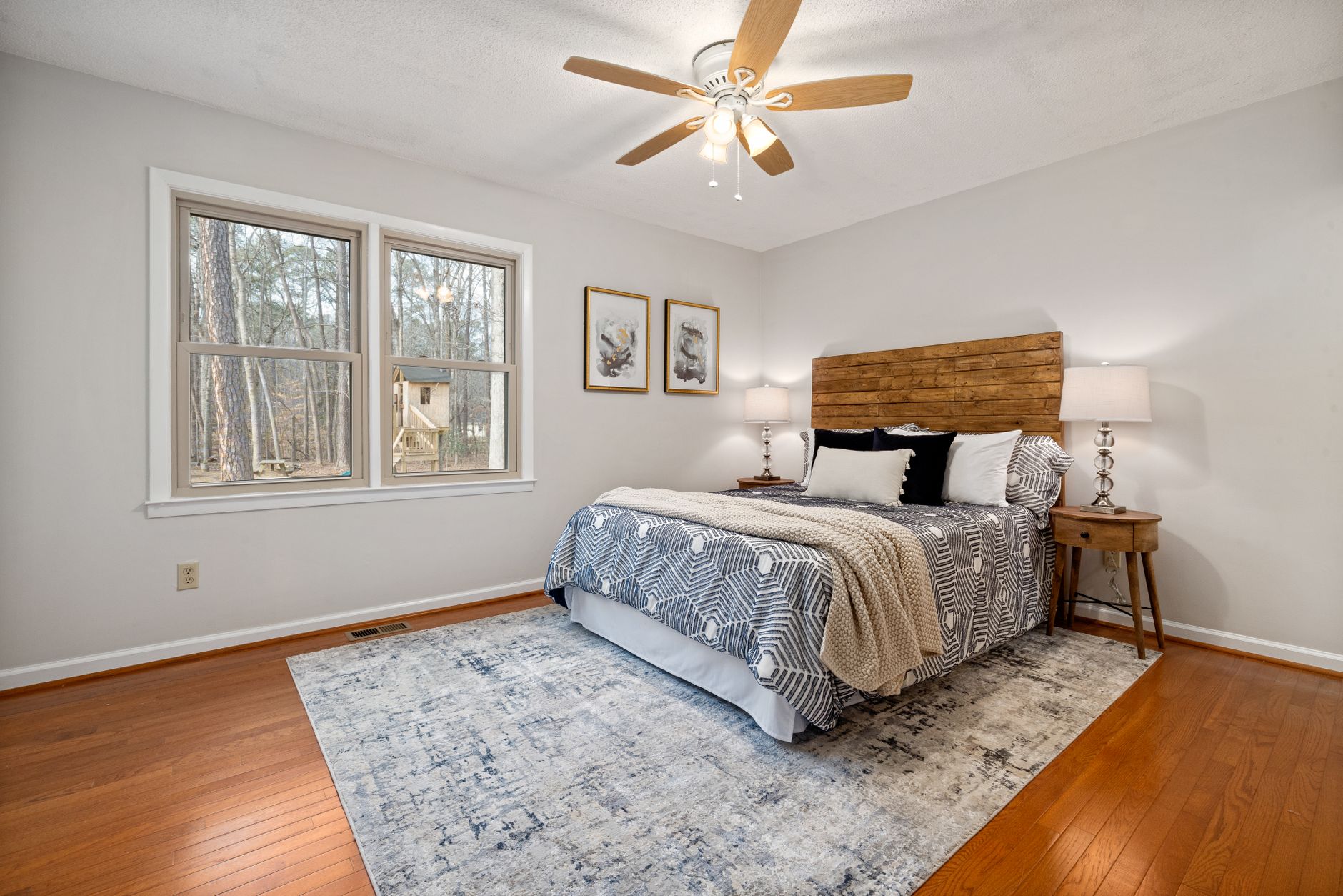 Cozy bedroom with rustic wood accents, natural light, and soft textiles.