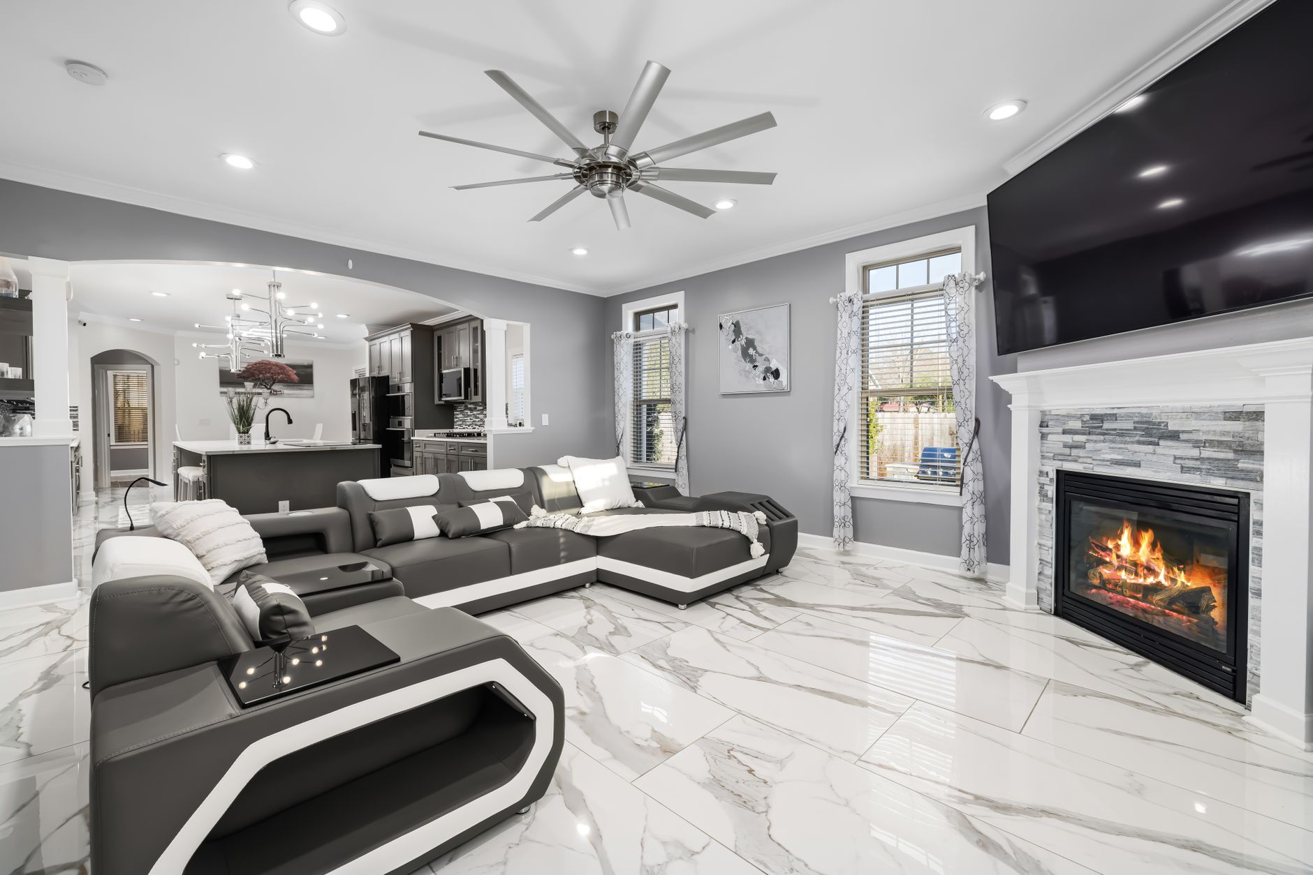 Elegant living room showcasing modern design, sleek furniture, and a cozy fireplace.