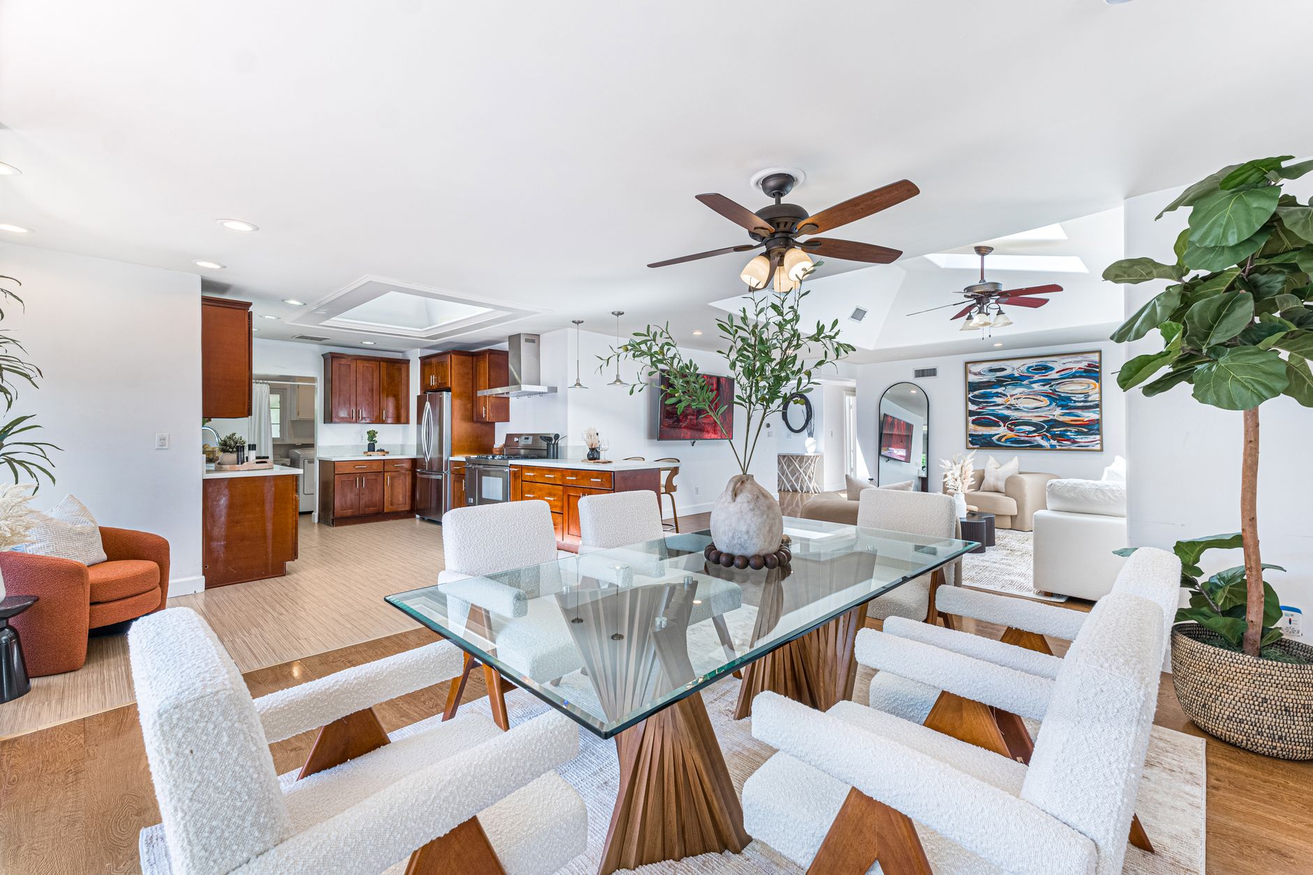 Bright and stylish open-concept living space featuring a minimalist dining area and cozy living room.