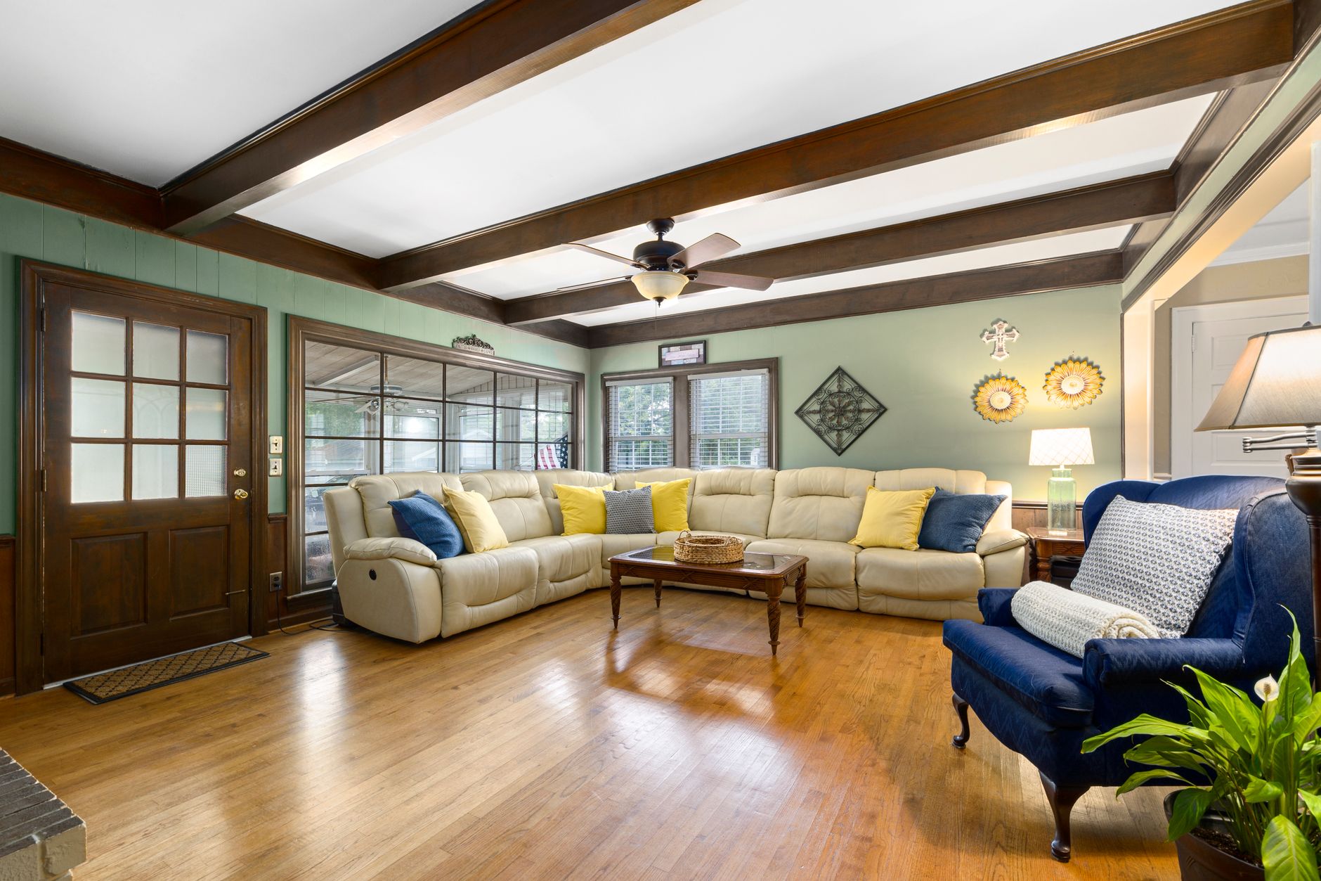 A bright and stylish living room featuring comfortable seating and natural lighting.