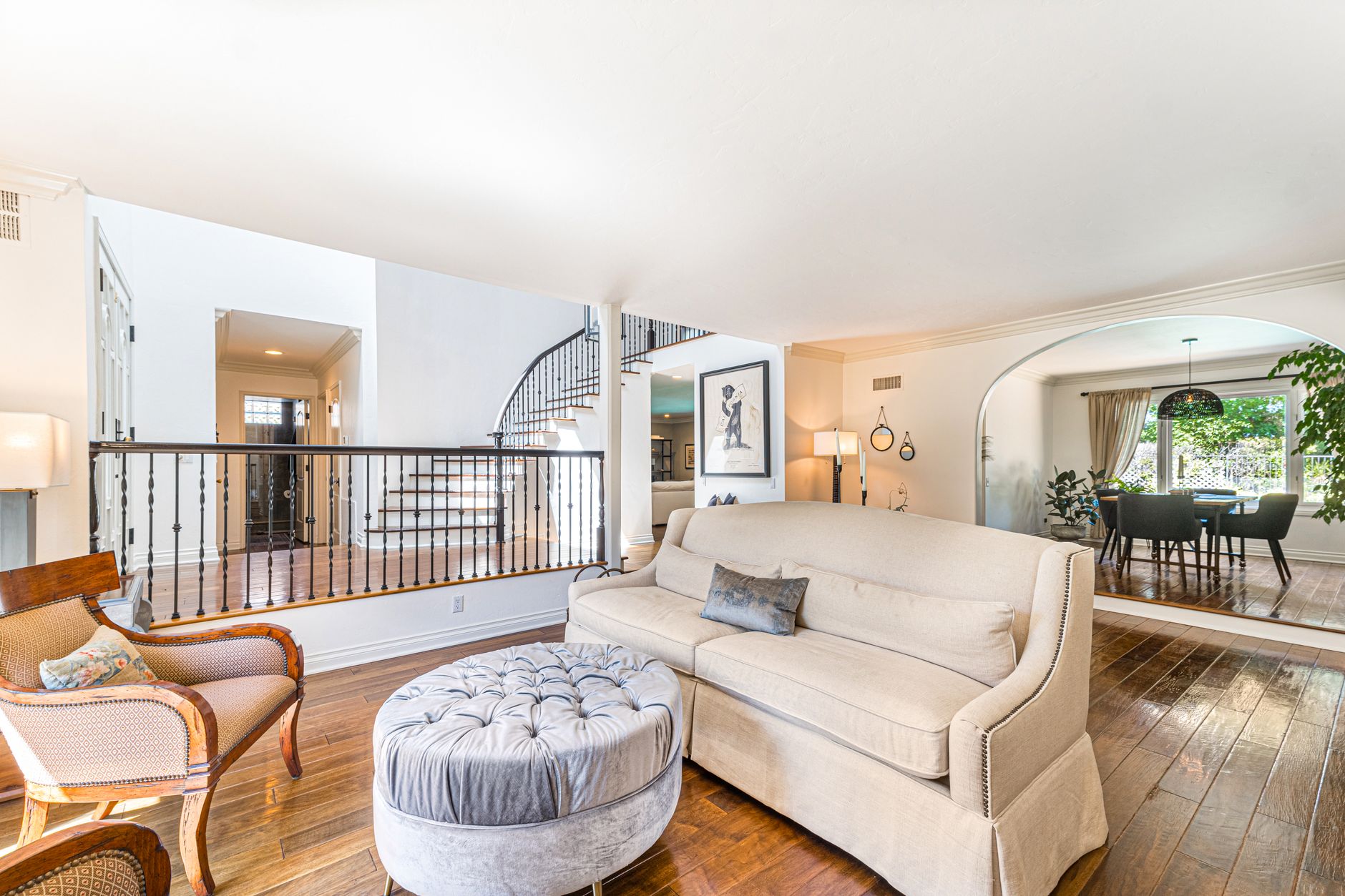Spacious minimalist living room with elegant decor and natural light, perfect for luxury home designs.