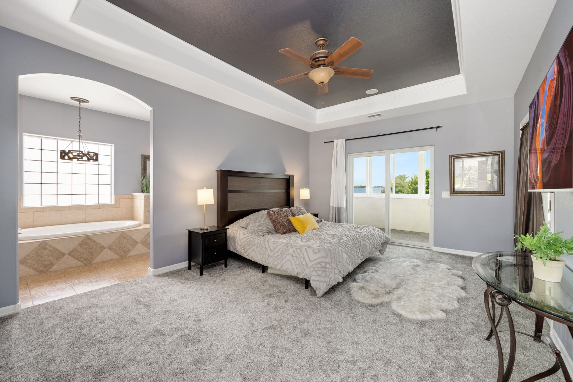 Spacious modern bedroom with stylish decor and natural light. Ideal for contemporary living.