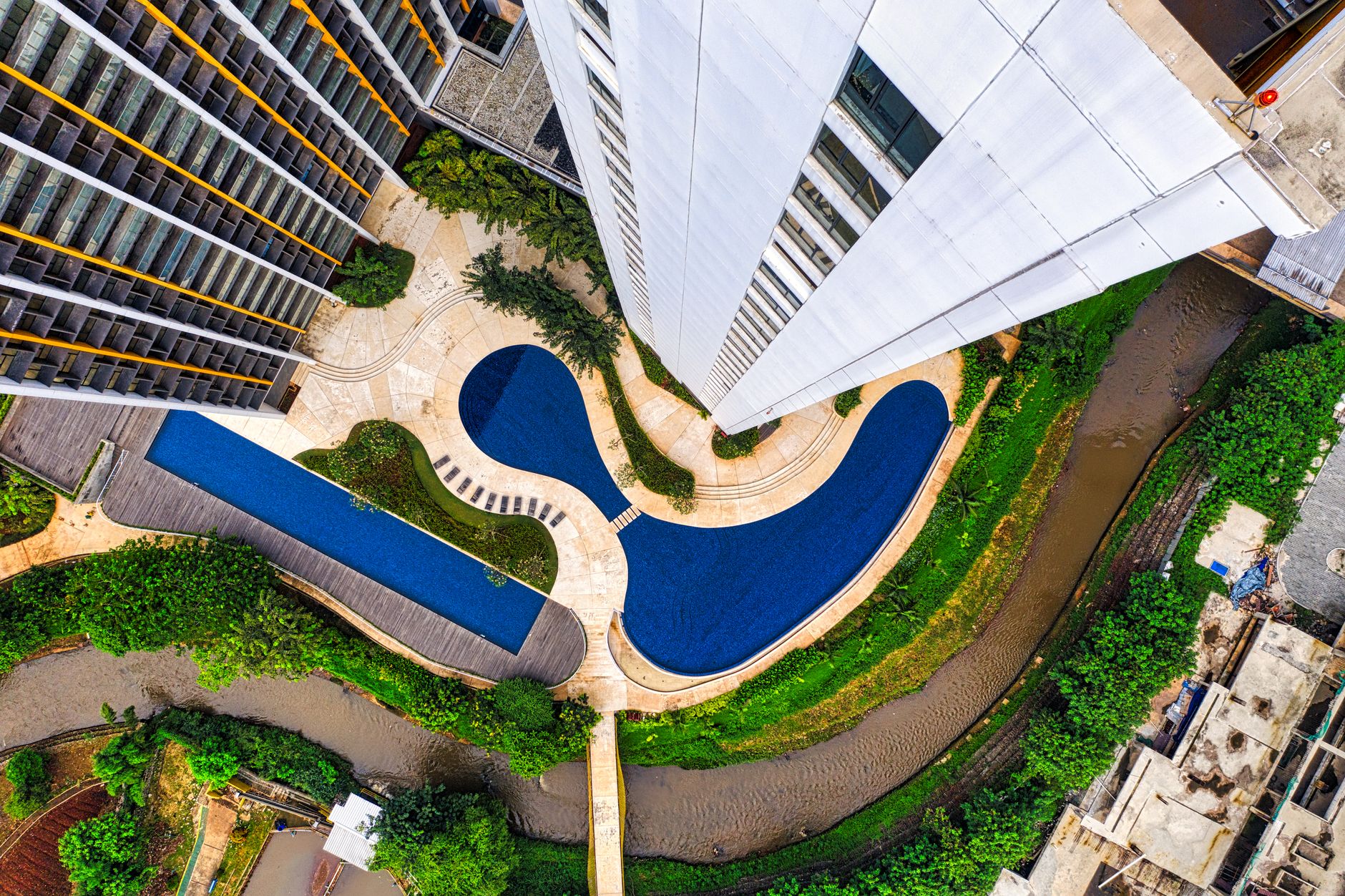 Aerial shot of contemporary architecture and swimming pool in Jakarta, Indonesia.