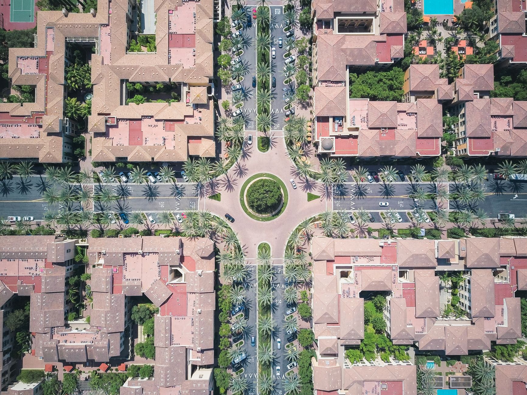 A top-down view of urban architecture featuring roads, buildings, and a roundabout.