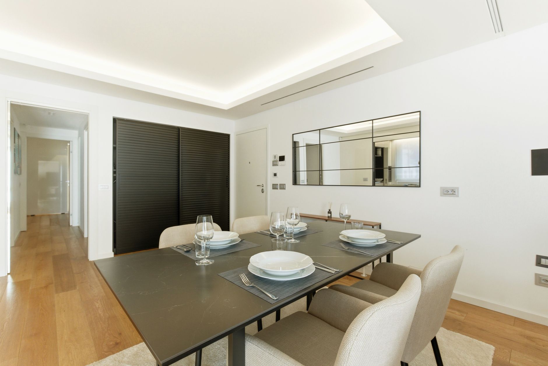 Elegant dining room interior with minimalist design and modern decor. Spacious and bright.