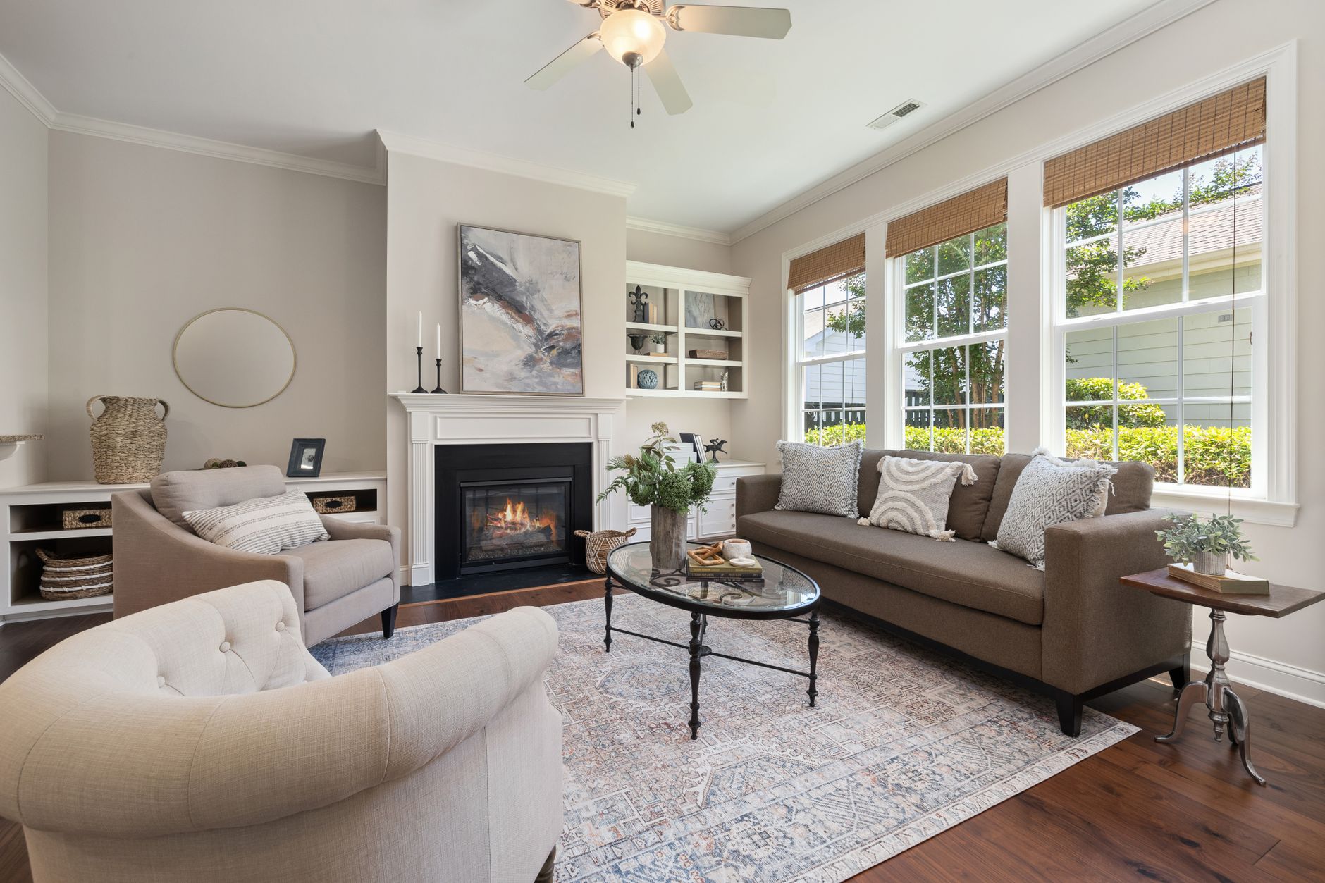 Bright and stylish living room featuring cozy fireplace and modern decor.