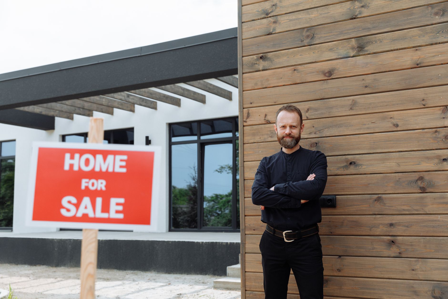 Real estate agent in Tucson using AI photography software on laptop