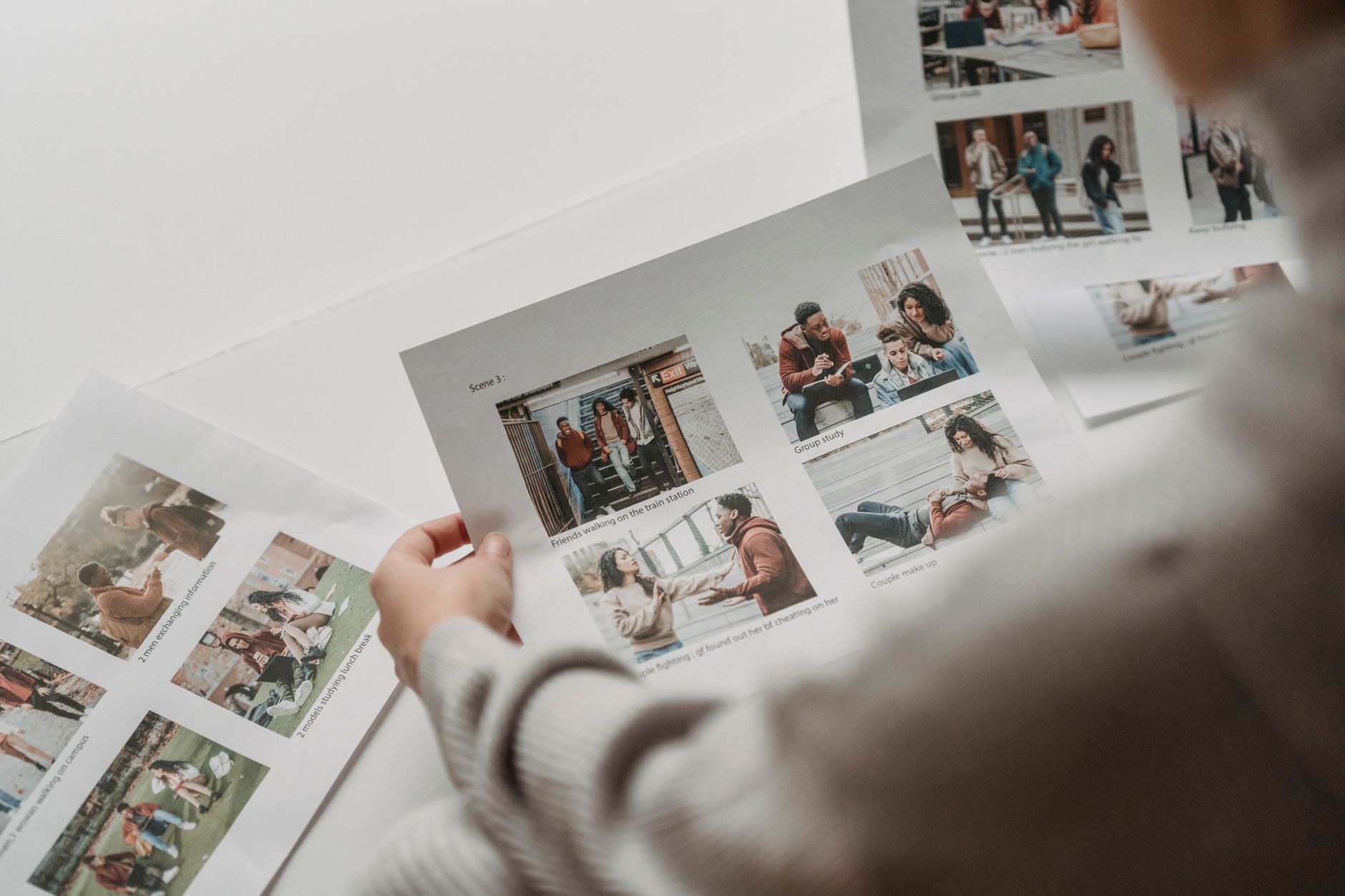 Agent reviewing property photos on laptop