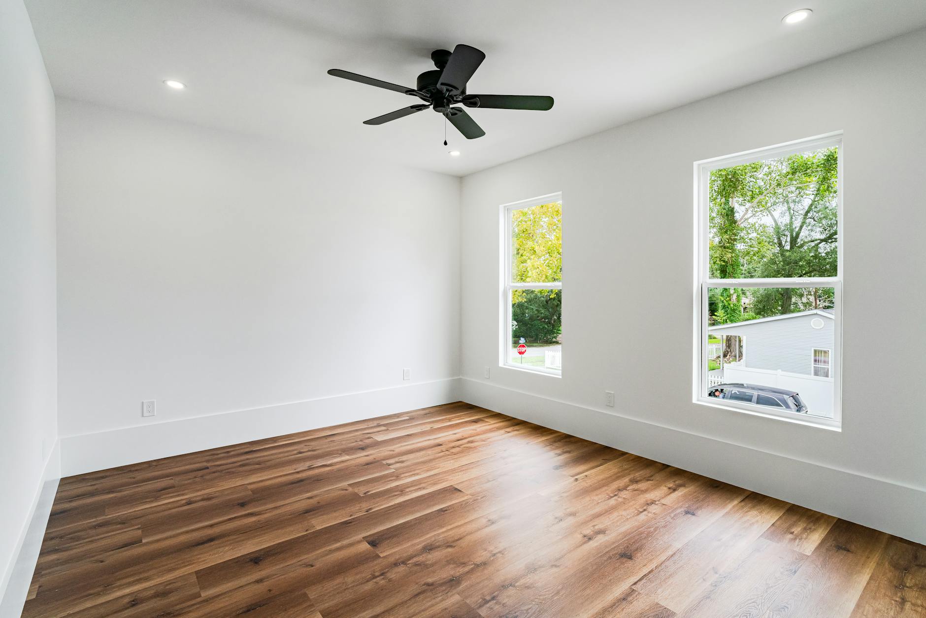 Before and after comparison of a San Antonio living room transformed through real estate photo enhancement