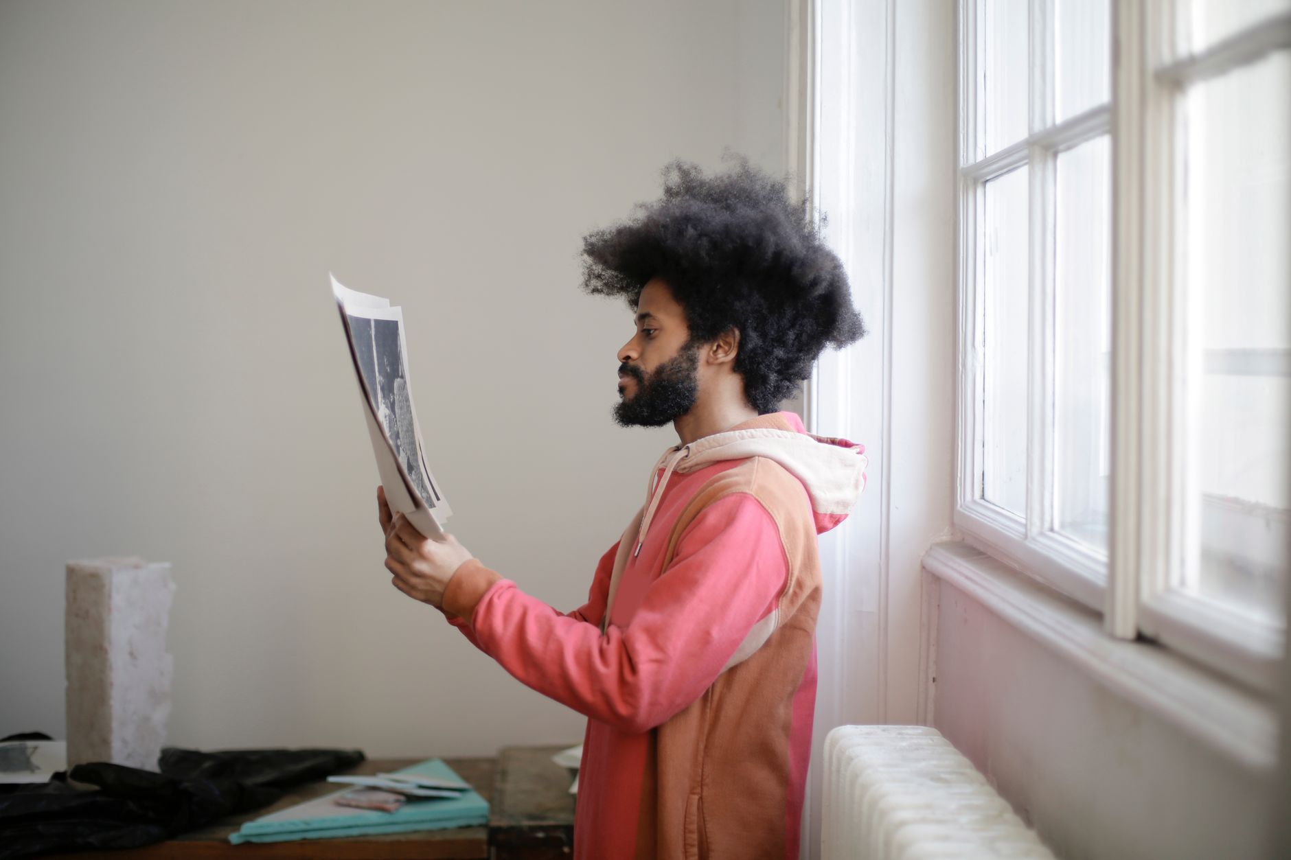 Real estate agent reviewing AI-enhanced property photos on tablet