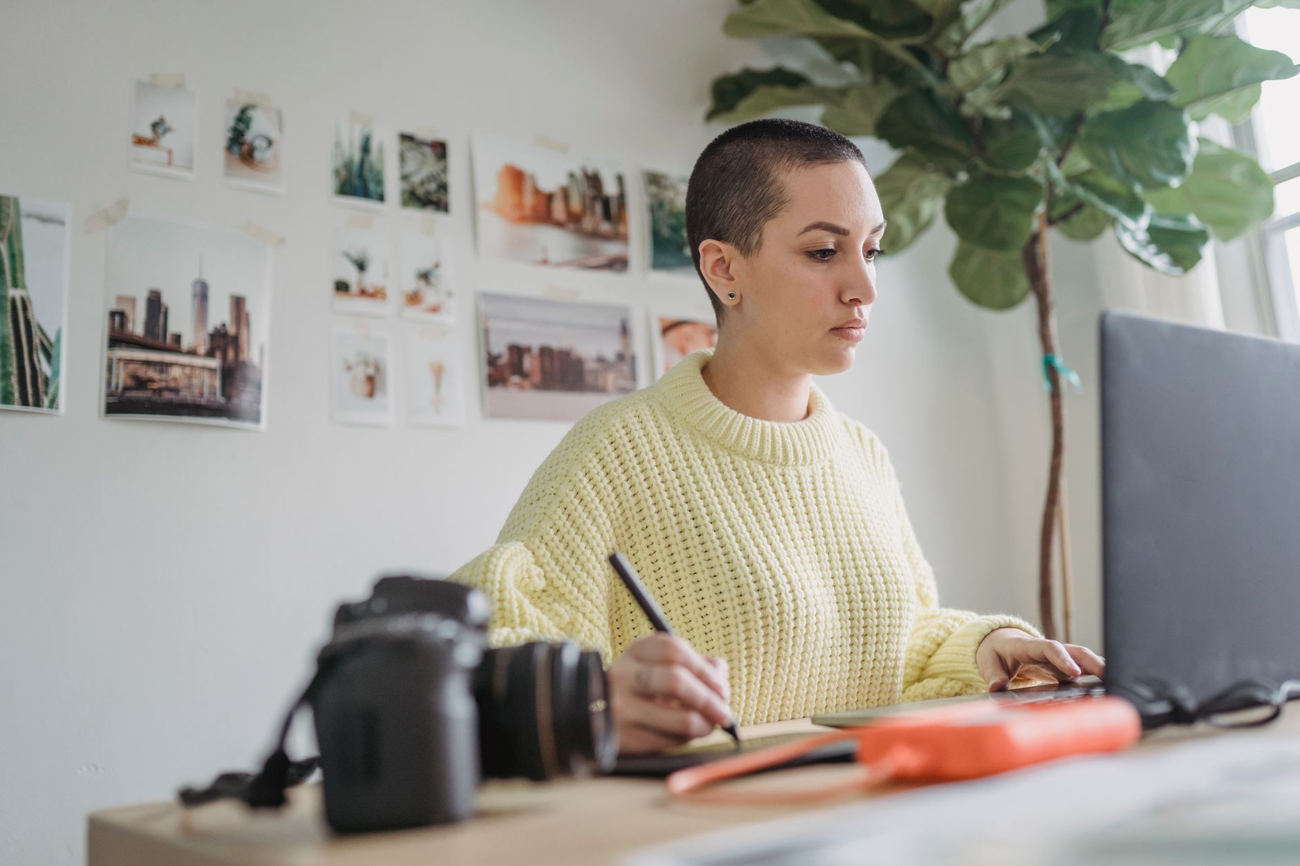 Real estate editor using dual monitors to enhance listing photos