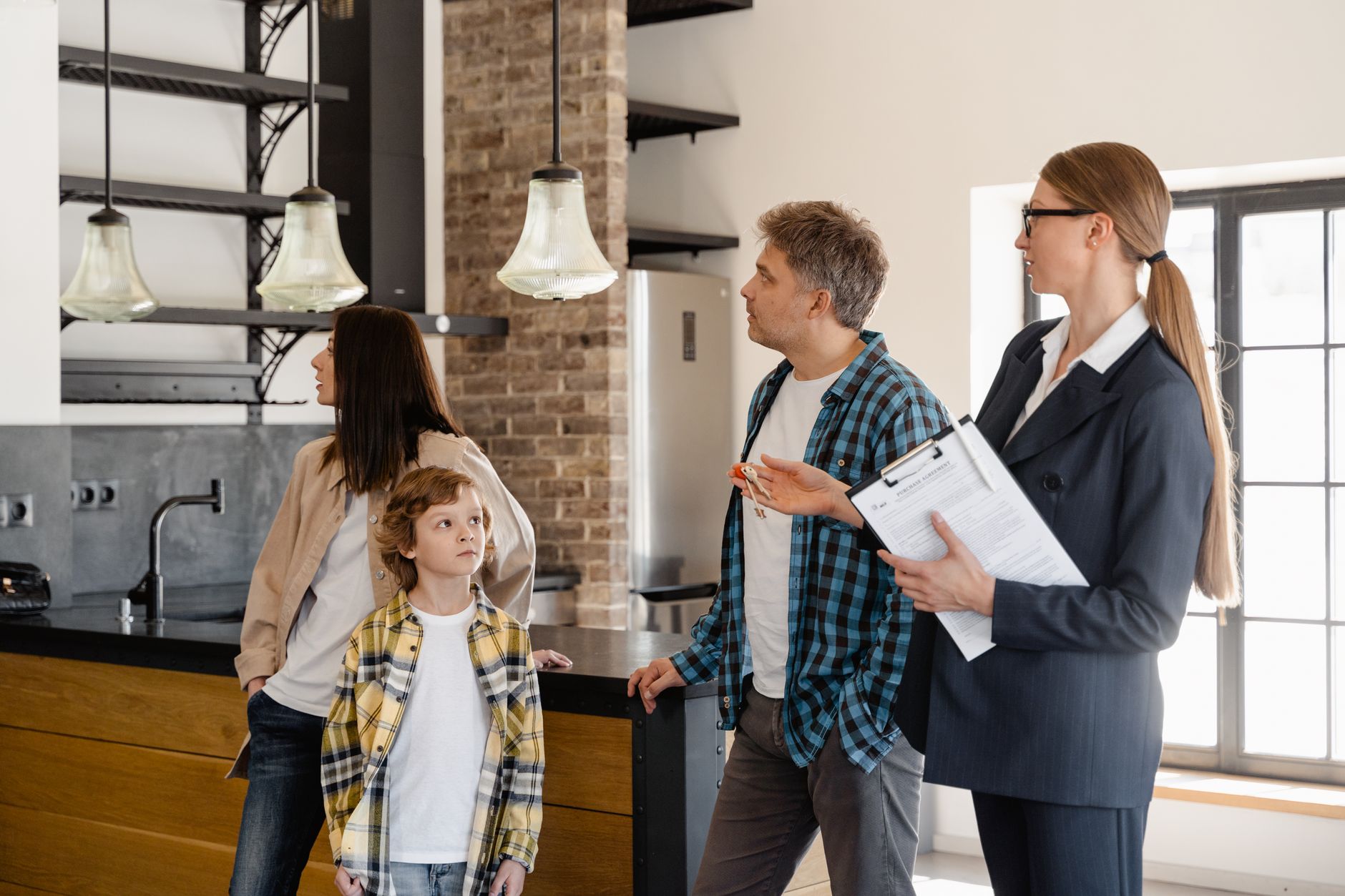 Professional real estate agent reviewing AI-enhanced property photos on tablet