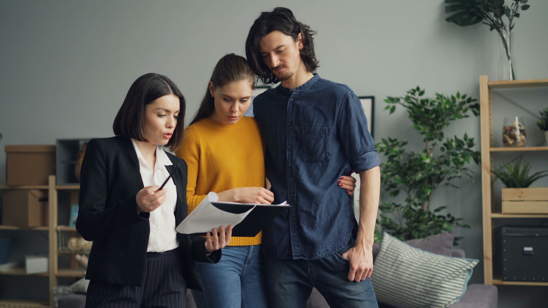 Professional real estate agent reviewing AI-enhanced property photos on tablet