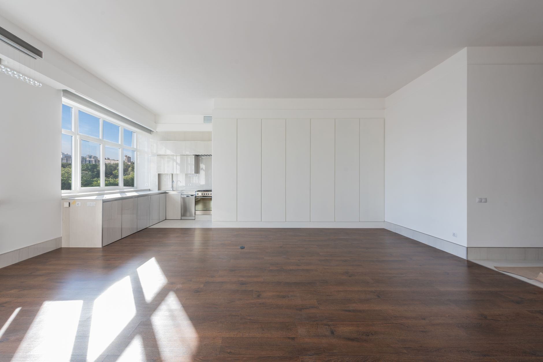 Professional using AI virtual staging software on laptop