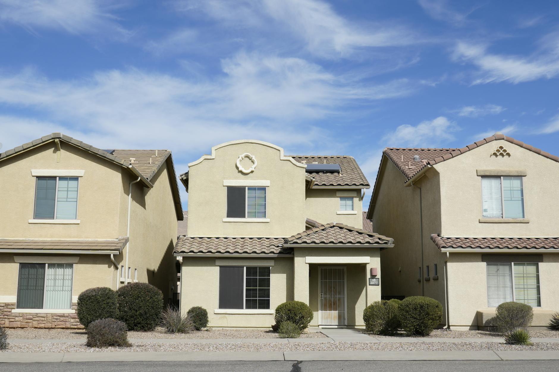Tucson desert home listing photo with enhanced lighting and clean desert landscaping