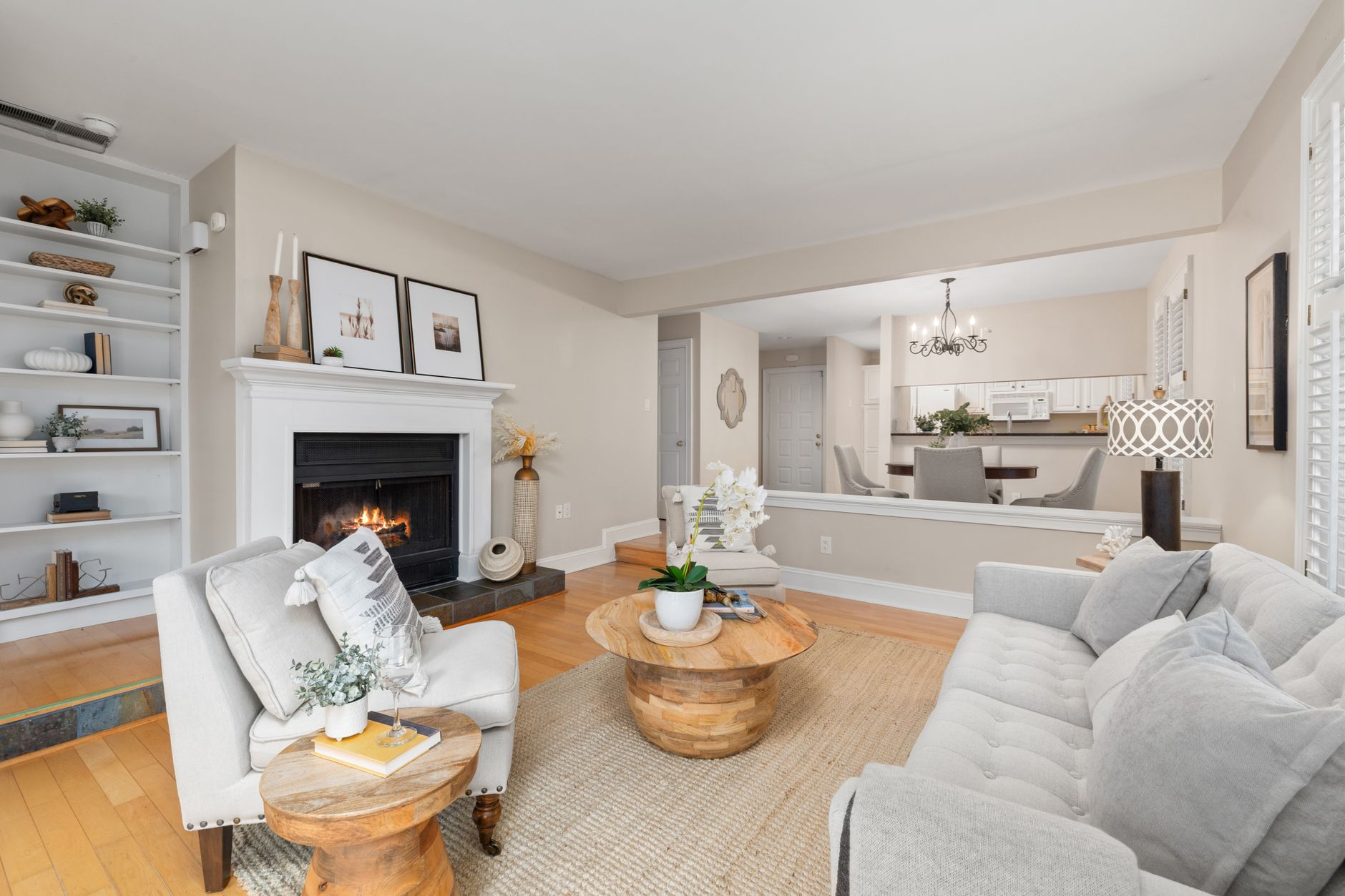 Elegant living room interior with a warm fireplace and chic decor accessories.