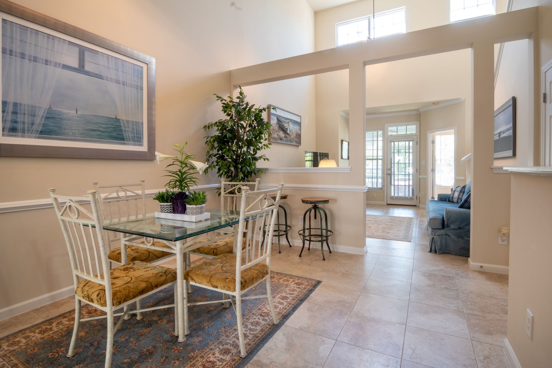 Modern and inviting open-concept dining and living area with natural light and elegant decor.