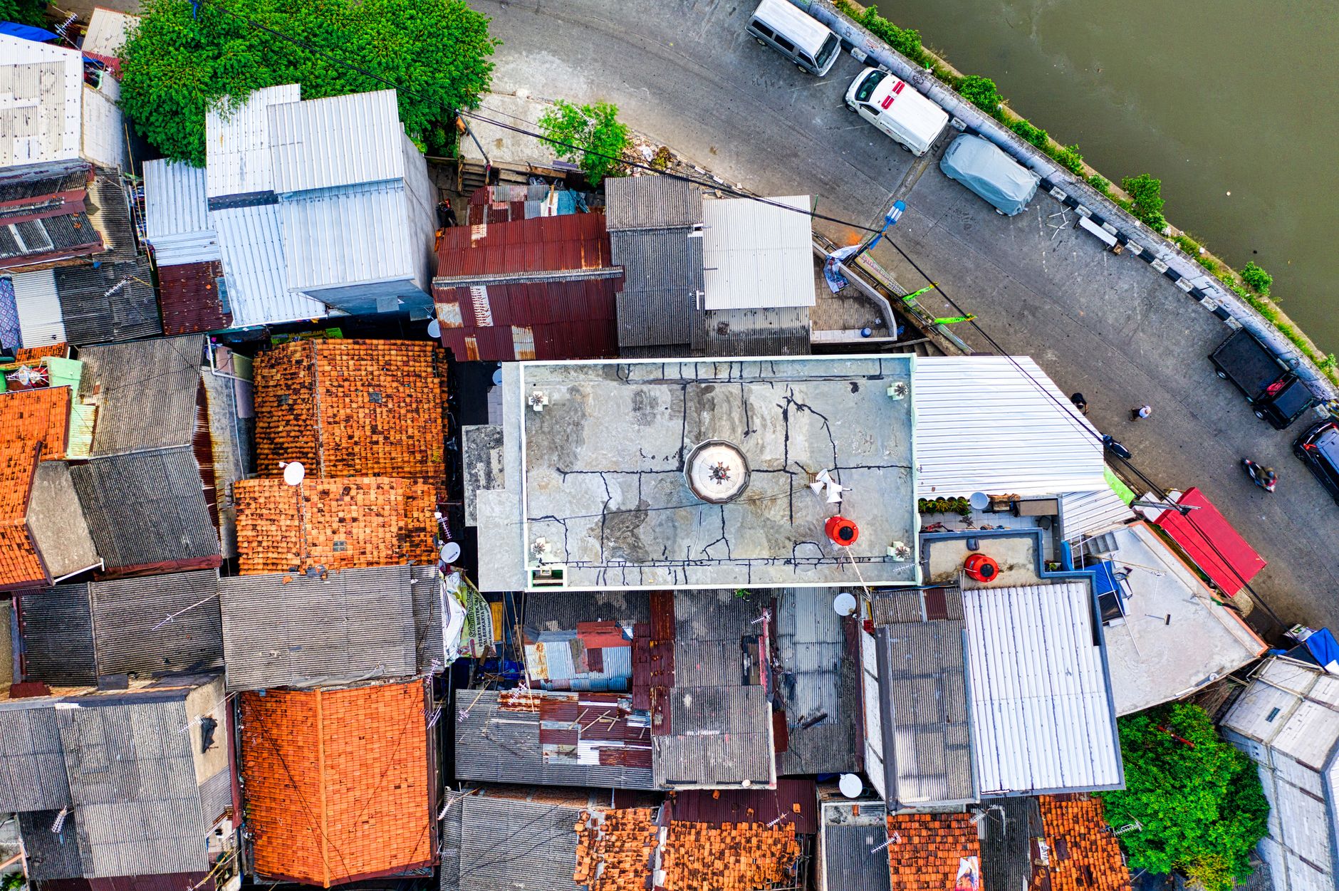 Detailed aerial image capturing rooftops and streets of an urban area. Ideal for travel and architecture themes.