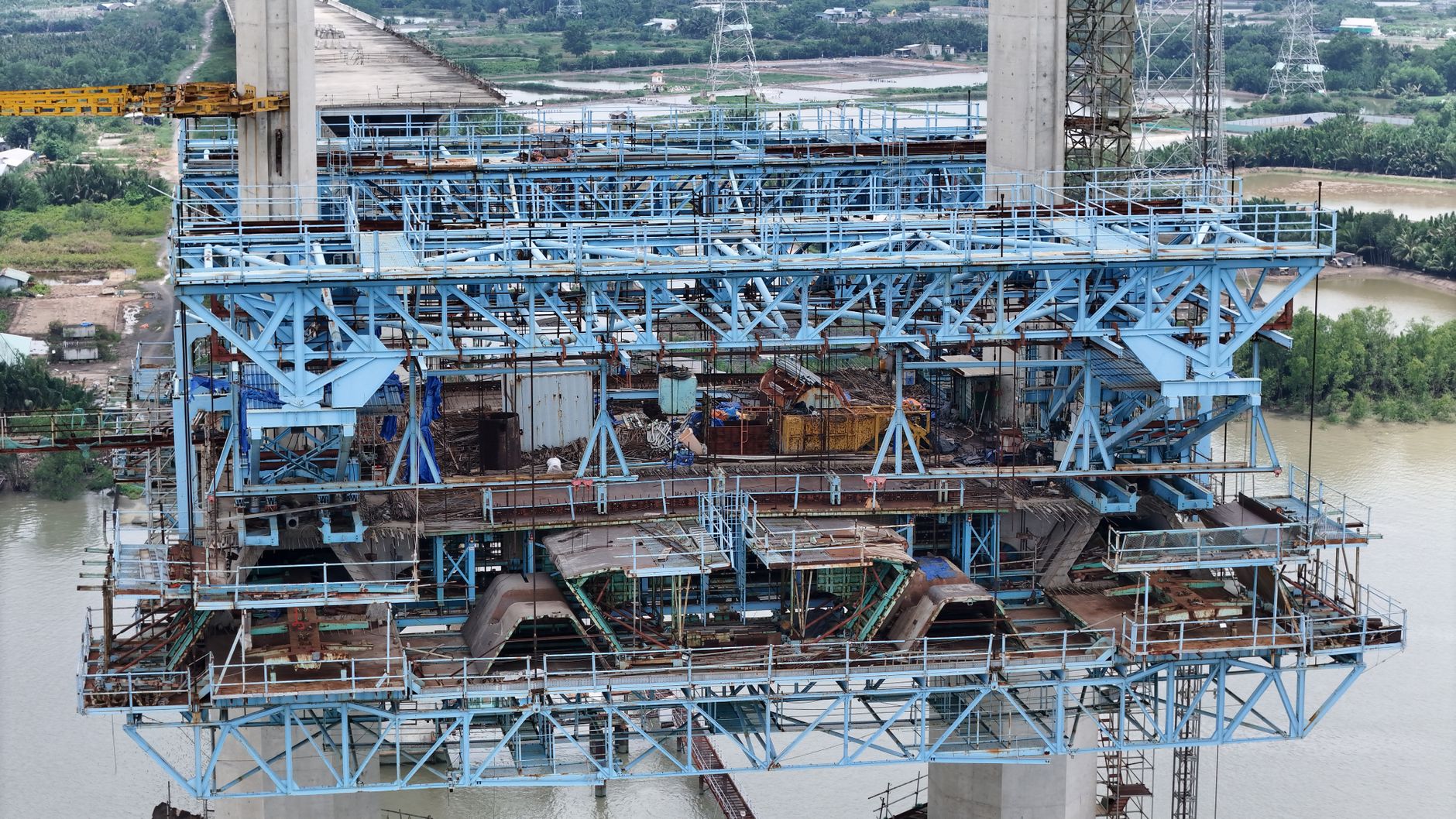 Detailed view of a cable-stayed bridge construction over a river in Vietnam.