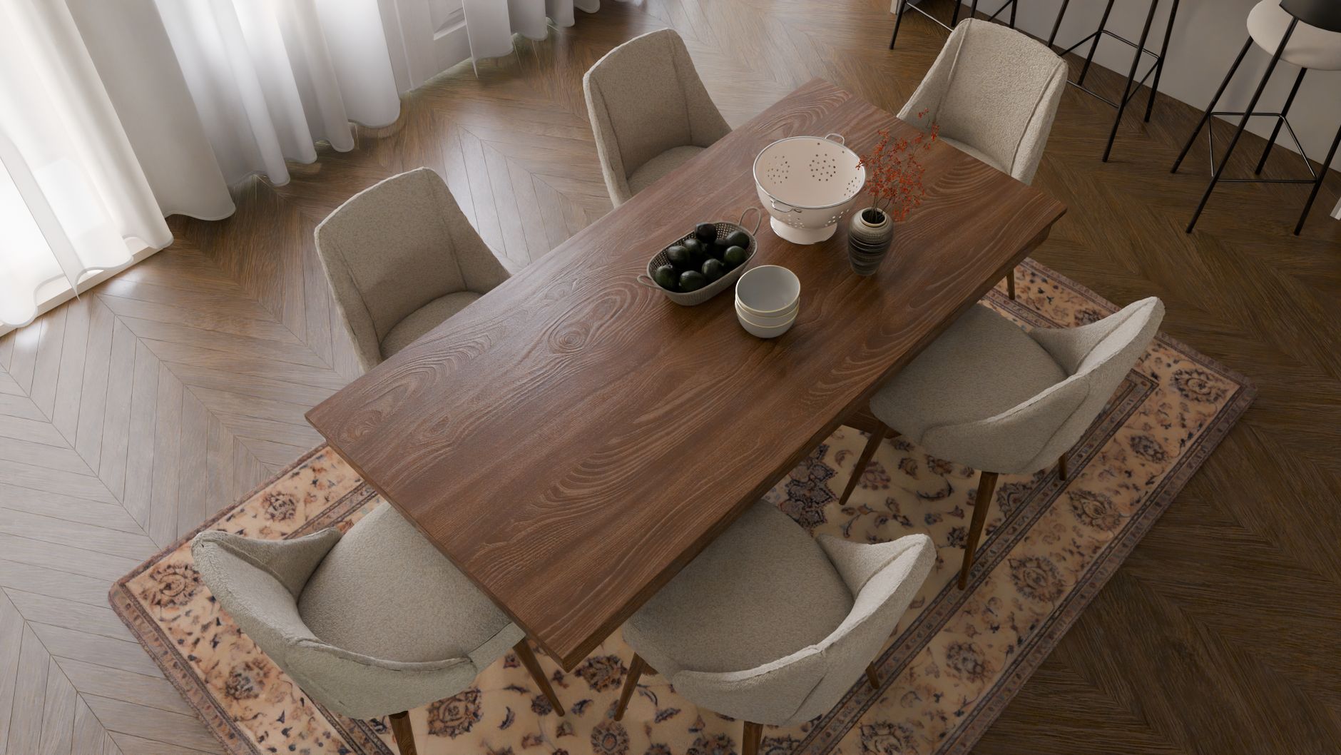 Sleek dining room with wood table and plush chairs on patterned rug.