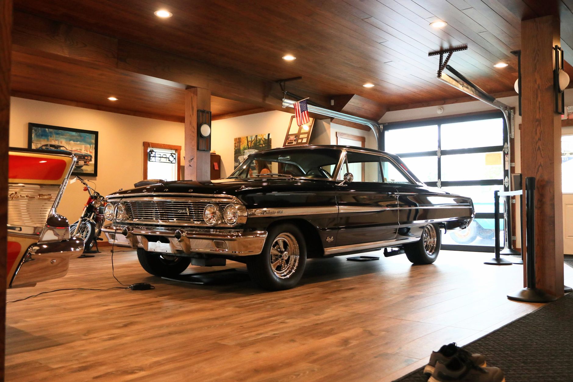 Beautiful display of a vintage car in a stylish indoor showroom with wooden interior.