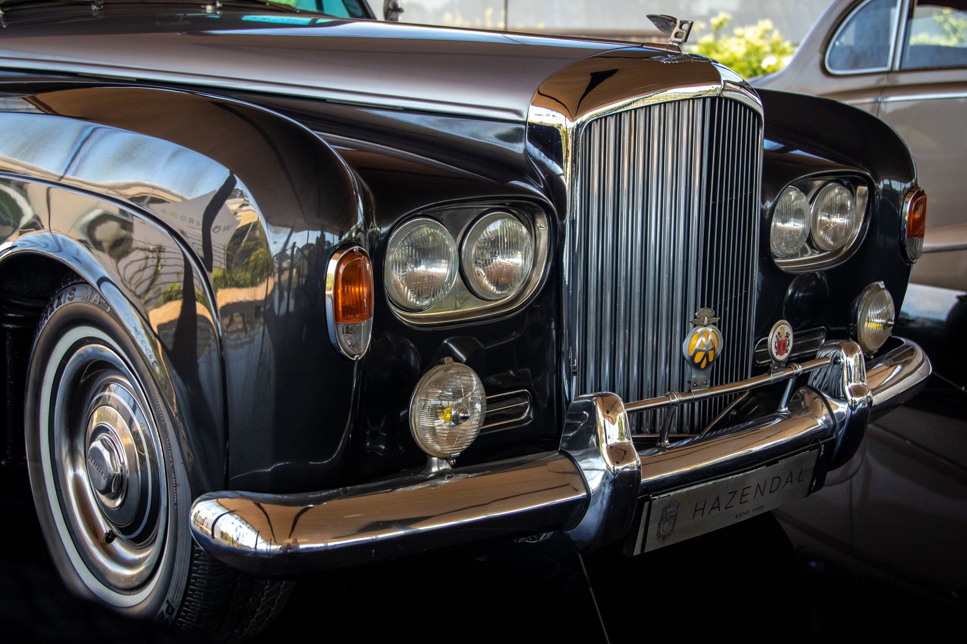 Close-up of a classic black Bentley showcasing luxury and vintage appeal.