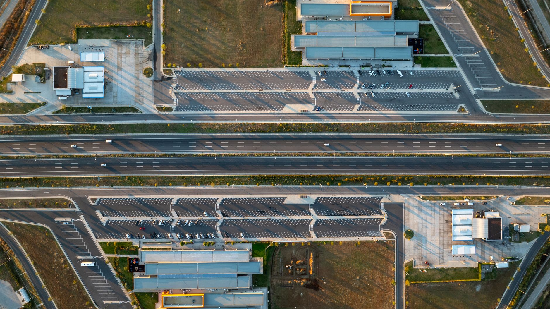 Aerial image showcasing a highway and parking lot in Şehzadeler, Manisa, Türkiye.