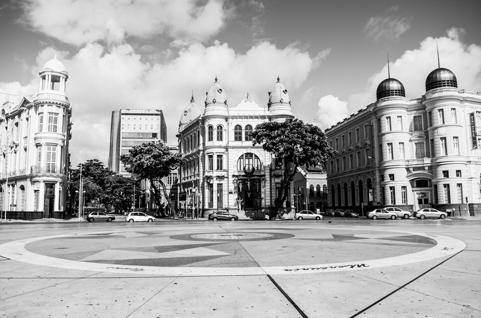 Black and white view of historic buildings at Marco Zero Square, Recife, Brazil, showcasing classic architecture.