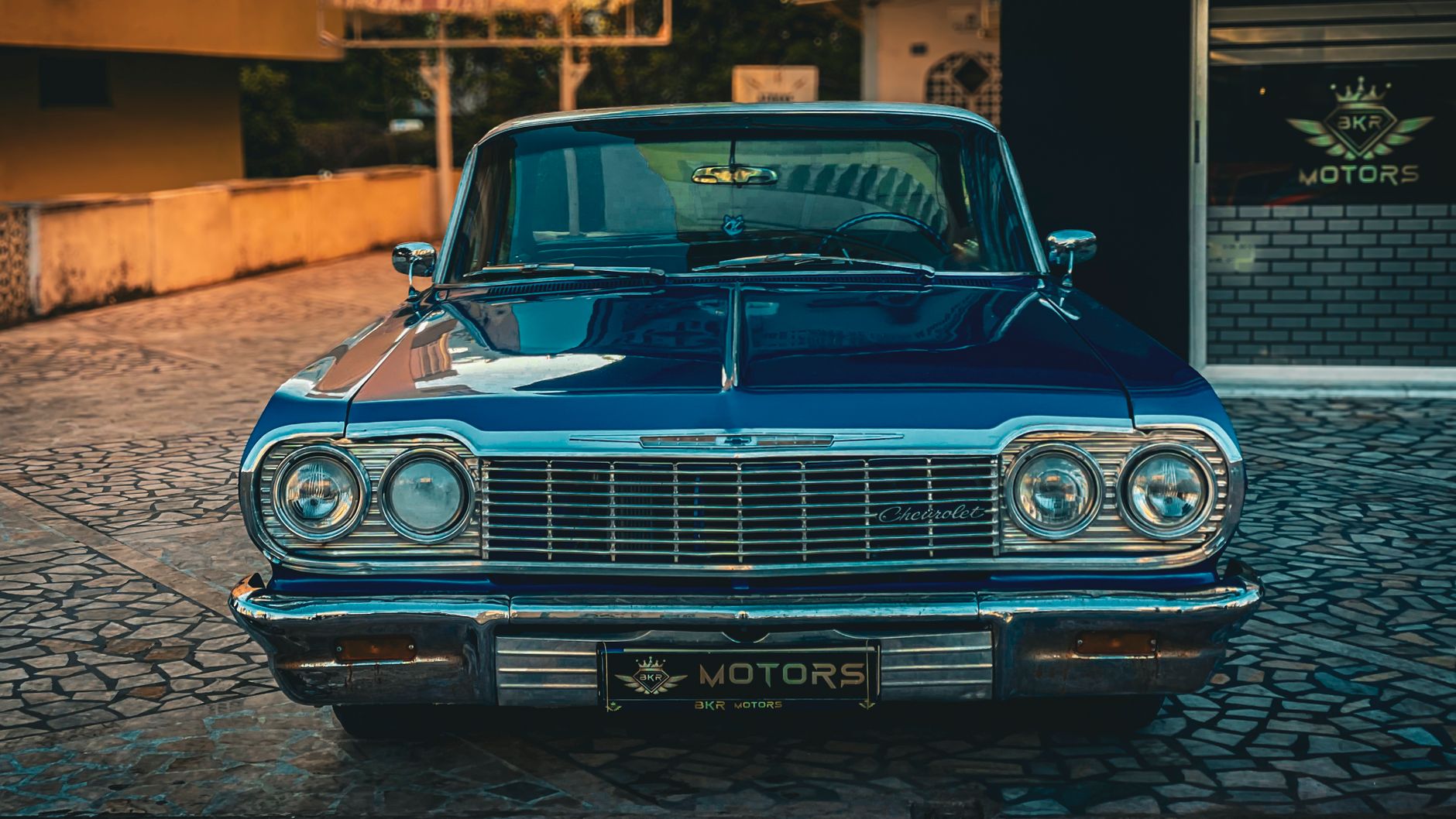 Front view of a classic 1960s Chevrolet car parked on a sunny day in Antalya, Turkey.