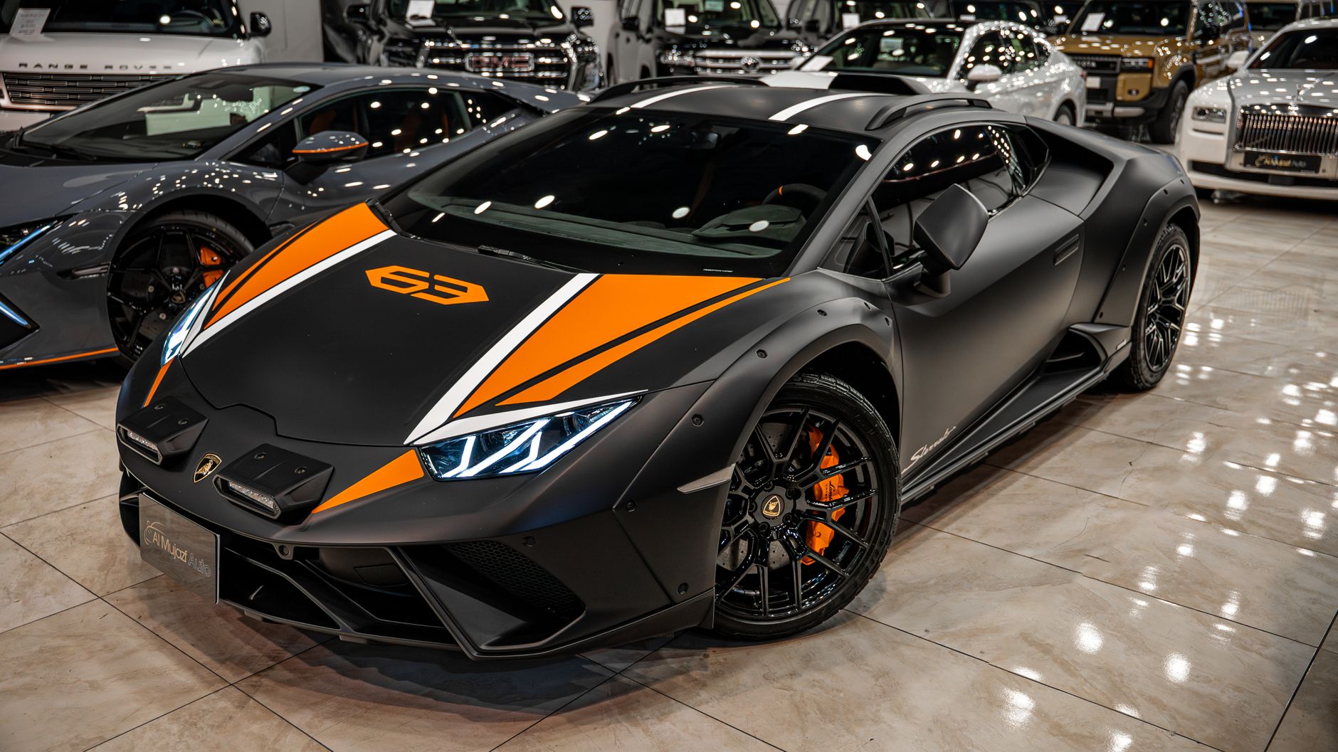 Stunning black and orange sports car on display in a Sulaymaniyah showroom.