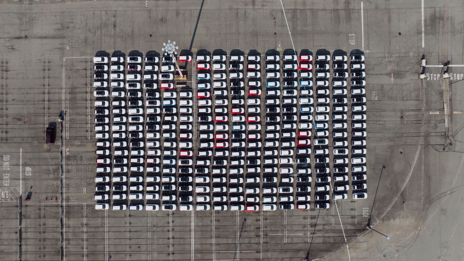 Aerial shot of an organized parking lot filled with cars in Seattle, WA.